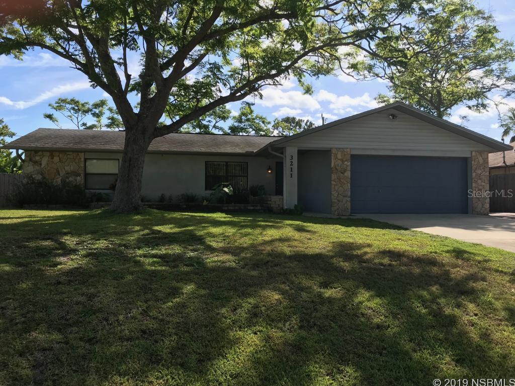Pet friendly 3 bedroom 2 bath home with very large fenced back yardnew carpet in bedrooms, 2 car garage located in Florida Shores