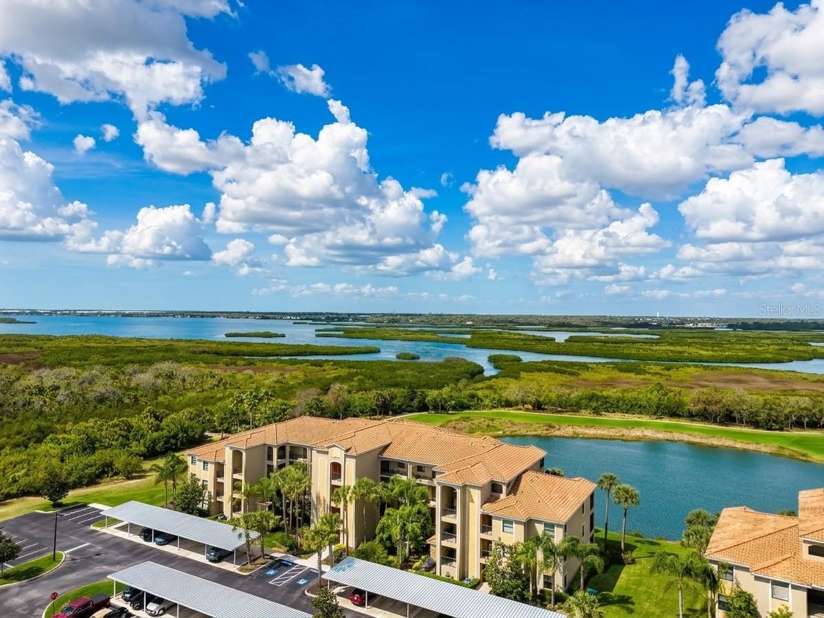 Welcome to 7005 River Hammock #304, a residence that rises above the competition by offering the complete package buyers are searching for in River Strand: a prime wide-open water and preserve view, tile flooring throughout, tasteful turn-key furnishings, a recently replaced AC unit, new water heater, a private storage unit, and the tremendous value of golf membership included in the HOA dues.

From the moment you enter, the difference is easy to feel. The home is bright, clean, and inviting, with an open layout that flows effortlessly from the dining area to the living room and out to the screened lanai. Large sliders frame a peaceful backdrop of water, greenery, and open sky, creating the kind of view that immediately sets this unit apart. Many condos offer interior space, but not all offer a setting like this. Here, the view becomes part of the living experience, bringing a sense of calm, privacy, and everyday beauty that buyers remember long after they leave.

Inside, the tile flooring throughout is a major advantage, giving the entire residence a more cohesive, upscale look while also making maintenance simple. The kitchen features granite countertops, abundant cabinetry, stainless appliances, and an open connection to the main living area that keeps everything feeling connected and functional. The furnishings are light, coastal, and comfortable, perfectly complementing the relaxed Florida lifestyle this property is all about.

Being sold turn-key furnished is another major reason this unit stands out. Buyers can close, bring a suitcase, and begin enjoying River Strand immediately. There is no long to-do list, no waiting, and no extra expense to furnish the home before it can be enjoyed. Whether you are searching for a full-time residence, a winter retreat, or a property with strong rental appeal, the convenience here is hard to overstate. The private storage unit adds even more value, giving you practical extra space for golf clubs, beach gear, owner items, and seasonal storage.

The lifestyle is where this property truly separates itself. Golf membership is included in the HOA dues, giving owners access to one of the community’s most sought-after benefits without the burden of an added membership cost. Beyond golf, River Strand offers the resort-style amenities buyers want most, including pools, tennis, pickleball, fitness centers, dining, and a vibrant social atmosphere. This is the kind of community where mornings begin on the lanai, afternoons can be spent on the course or by the pool, and evenings can end with dinner, friends, and the feeling that you are living in a private resort rather than an ordinary condo community.

For buyers comparing what is currently available, 7005 River Hammock #304 checks the boxes that matter most: the better view, hard-surface flooring throughout, updated comfort with the newer AC, true turn-key convenience, extra storage, and the built-in value of bundled golf and outstanding amenities. This is more than just another condo for sale. It is a polished, move-in-ready opportunity to own a beautifully furnished piece of the River Strand lifestyle with the kind of comfort, scenery, and ease that make it stand out from the rest.