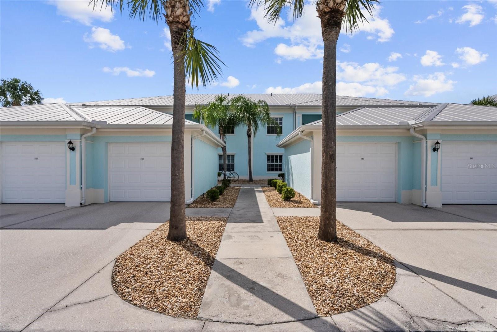 If you want relaxing, tranquil water views and beautiful sunsets, this 2 bedroom, 2 bath first floor condo with a versatile bonus room is waiting for you in desirable community of The Colony at Sabal Trace.  As you enter the condo the first thing that you notice is the view through the living room to the screened lanai and to the lake. The living room with its recently installed laminate wood flooring, tray ceilings and neutral pallet is waiting for your personal decorating choices. The condo has laminate wood flooring throughout except for tile flooring in the kitchen and bathrooms. The kitchen has extended 36" upper cabinets, ample counter space, breakfast bar and a double door closet pantry, all for the chef in the family. The spacious master bedroom has wonderful water views from the window, a walk-in closet, second single closet and a linen closet off the hall to the en-suite bath. The bath has a single sink vanity, separate section for commode and walk-in shower. The split floor plan has second/guest bedroom and a second bathroom with a tub/shower. The condo has versatile bonus room that can be used as a dining room, den, office or extra sleeping area. The main focal point is the screened and tiled lanai with wide lake views that is perfect for that morning coffee, relaxing with a good book or enjoying afternoon wine and cheese waiting for sunset. The condo has an indoor utility area with washer/dryer, an outside storage closet and a single car garage right outside the front door. The gated community has a clubhouse with a meeting area, kitchen, pool and ping pong tables, fitness room and especially the heated swimming pool with sun decks to capture the FL lifestyle. The community is close to shopping, restaurants, world class fishing, Gulf beaches, golf courses and spring baseball stadiums.