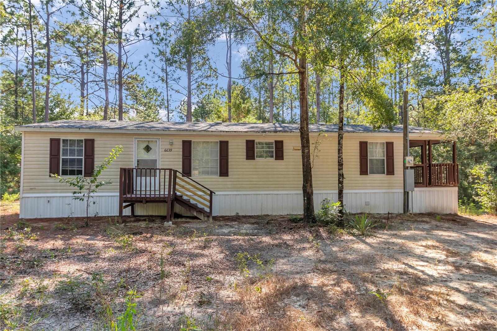Charming 3-bed, 2-bath updated home tucked away on a quiet, secluded road. This property offers the perfect blend of privacy, comfort, and convenience—just 30 minutes from Gainesville, Cedar Key, and WEC. Step inside to find new flooring, updated bathrooms, updated  plumbing. The spacious living area features a cozy fireplace, while the kitchen and baths showcase modern finishes. Outside, enjoy over 0.52 acres with a new well, new septic, new drain field, and updated power—all utilities are fresh and ready to go. The 2019 roof & AC, brand-new skirting, and clay loop driveway (perfect for a future shop) make this home truly move-in ready. Whether you’re relaxing on your peaceful property, exploring the nearby coast, or enjoying equestrian events, this home puts it all within reach.