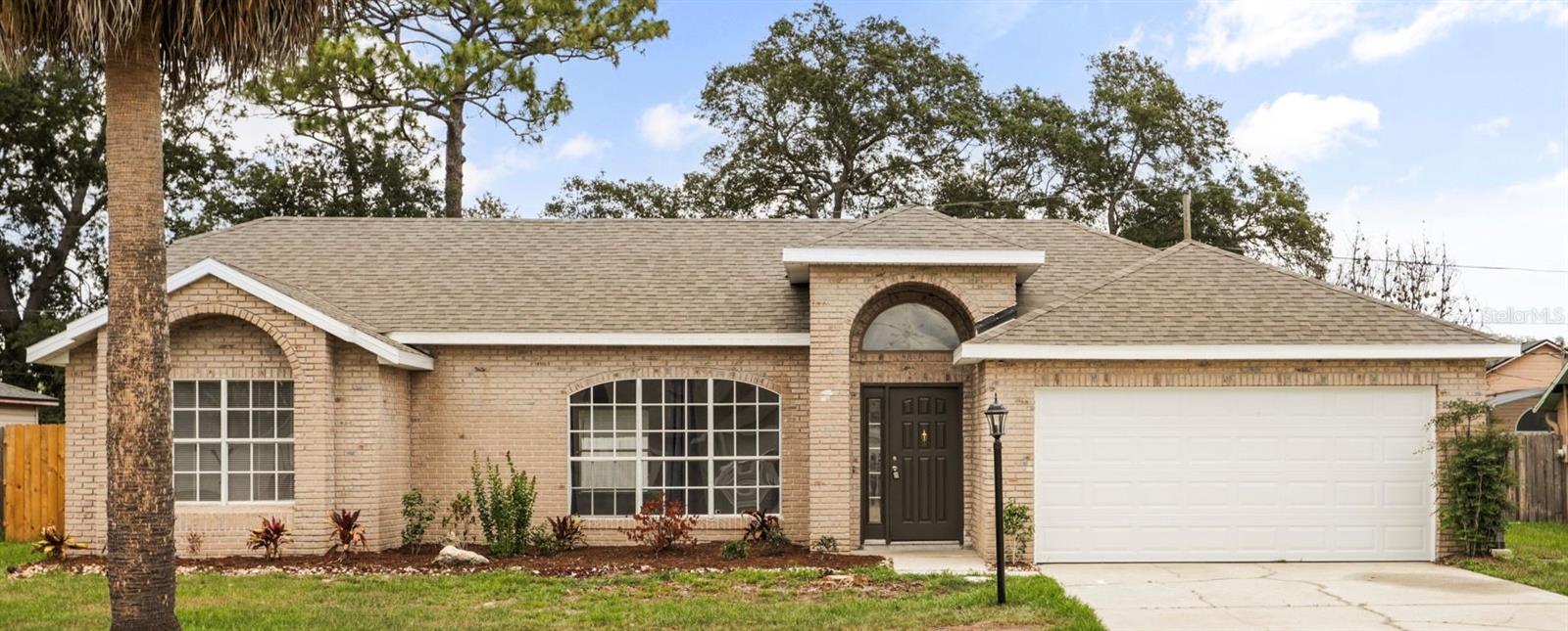 Welcome to this beautifully renovated pool home in the heart of Deltona featuring a NEW ROOF (2026), NEW HVAC SYSTEM (2026), and NEW WATER HEATER (2025)! From the moment you walk in, you’ll notice the soaring vaulted ceilings, abundant natural light, and bright open living spaces that make this home feel both spacious and inviting.

This 3-bedroom, 2-bath home offers 1,758 heated square feet with stylish modern updates throughout. The renovated kitchen features modern cabinetry, stone countertops, stainless steel appliances, and a functional layout that flows seamlessly into the main living and dining areas, making the home ideal for both everyday living and entertaining.

Both bathrooms have been thoughtfully updated with contemporary finishes and fixtures, while updated flooring and fresh interior finishes throughout give the home a clean, cohesive, move-in-ready feel.

Step outside to your own private backyard pool area, perfect for relaxing, hosting family and friends, or enjoying Florida living year-round. The property also features a spacious 2-car garage with laundry hookups and a generously sized yard with room to personalize and enjoy.

Conveniently located near shopping, restaurants, parks, schools, and major roadways with easy access to Orlando, Daytona Beach, and the east coast beaches.

From the major system upgrades to the modern interior finishes and private pool, this home delivers the perfect combination of comfort, style, and functionality.