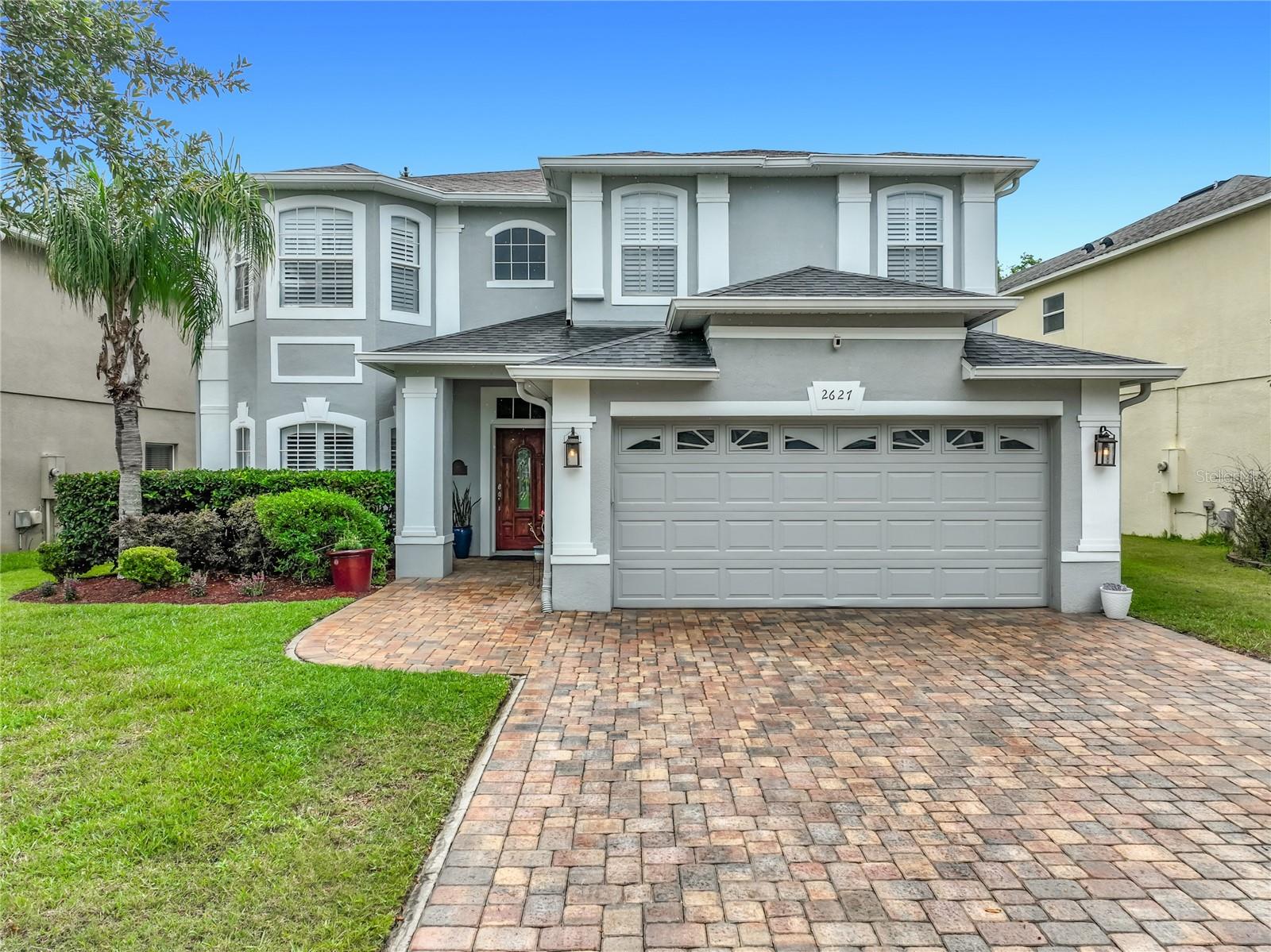 Comfort, Style, and Convenience await you in the Gated Golf Course Community of Stoneybrook East!  Beautifully updated home nestled on a quiet conservation lot, this home offers a peaceful lifestyle among all of the great shopping, dining, theme parks and entertainment that Orlando has to offer.   Upon entry, the magnificent chandelier makes a statement of elegance, while the hardwood floors bring warmth and comfort.  The updated kitchen is well appointed with stainless steel appliances and modern granite countertops that look into the family room  for entertaining ease.  The expansive master bedroom is an owners delight, with a large shower with double rainfall shower heads for a spa like experience, and a large custom walk in closet.   The oversized gameroom, or flex space, is equipped with a wet bar that makes entertaining, or quiet family movie nights a breeze.   Enjoy pool days and peaceful mornings on your large screened in back patio with views of the conservation and don't forget to stay and watch the amazing sunsets, they never disappoint!  Updates and features worth mentioning:   Roof replaced in 2021, Exterior painted 2022, Solar heated salt water pool panels re-installed in 2022, Energy efficient LED lighting throughout, Paver driveway and pool deck, Custom plantation shutters throughout the home, Storage room off the master bedroom for organized living, garage with keypad access and phone app connectivity for security and convenience, community club house with gym,  pool, splash pad,  tennis, pickleball, basketball, playground, vita course, and offering community events throughout the year.  Easy access to  408, 528, 417, UCF, Valencia, theme parks, shopping, and dining.  If you're seeking a move-in ready home with modern comforts, resort-style amenities, and a prime location, this property checks all the boxes.  Schedule your tour  to experience the lifestyle this home has to offer.