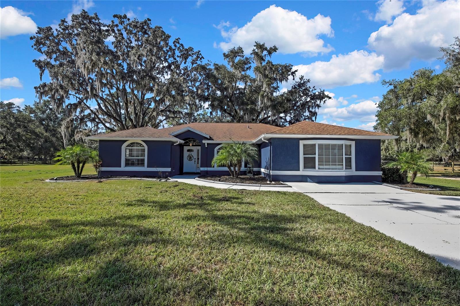$25,000 Price Improvement! 14.6 Beautiful Acres in Brooksville, Florida — Updated Home with Equestrian Amenities. Experience the perfect blend of privacy, convenience, and country living on this stunning farm property in Brooksville. Whether you're envisioning a personal homestead, a working farm, or a full equestrian retreat, this property offers the space, comfort, and versatility to bring your vision to life. Beautifully updated home features 3-bedroom, 2-bath split plan with modern updates, abundant natural light, and a functional layout designed for everyday comfort. Thoughtful upgrades throughout the home include gorgeous, updated kitchen with solid surface counters, easy close cabinets, beautiful wood look tile throughout this home makes the floor plan flow gracefully. The owners have taken such pride in their home, with an updated owners suite , all of which create a stylish and serene move in ready feel. Horse lovers, animal lovers, and hobby farmers will appreciate the expansive outdoor space designed for those who love land and want their own private retreat. A newly added 30' x 60' pole barn, 2 stall horse barn, basketball court, additional storage shed, and an RV hookup at the rear of the house are just a few of the great qualities of this electric gated property. Plenty of cleared land, pastures for your farm animals to roam and woods in the rear for privacy, the possibilities are truly endless. This unique estate is conveniently located just off US 41 on the outskirts of town, offering the tranquility of a farm with easy access to amenities.  With 14.6 acres of peaceful, private countryside, this property offers the rare combination of seclusion and accessibility. Enjoy the quiet rural living while staying close to town conveniences, major roadways, and an easy commute to Tampa!