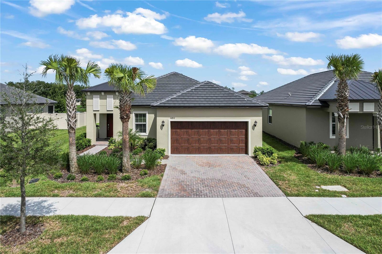 This meticulously maintained 2025 home is just steps to the stunning Clubhouse and all the fun activities.  And while your future home is close to the action, it is perfectly positioned on a quiet cul-de-sac overlooking a tranquil pond and beautiful wildlife.  The well-designed floor plan offers an inviting kitchen/dining/living space; spacious primary bedroom, bath and walk-in closet; guest bedroom and adjacent full bathroom; ample flex/office space just off the foyer; indoor laundry room; and separate work counter leading to the two-car garage.   Added value items include a high-end Titan water conditioning system; HVAC ultraviolet light and 10-year extended warranty and enclosed lanai.  Furniture is negotiable.   And since the home is through the warranty process and in Angeline's desired Phase One neighborhood, you won't have the headaches of new construction.  We look forward to you visiting soon!