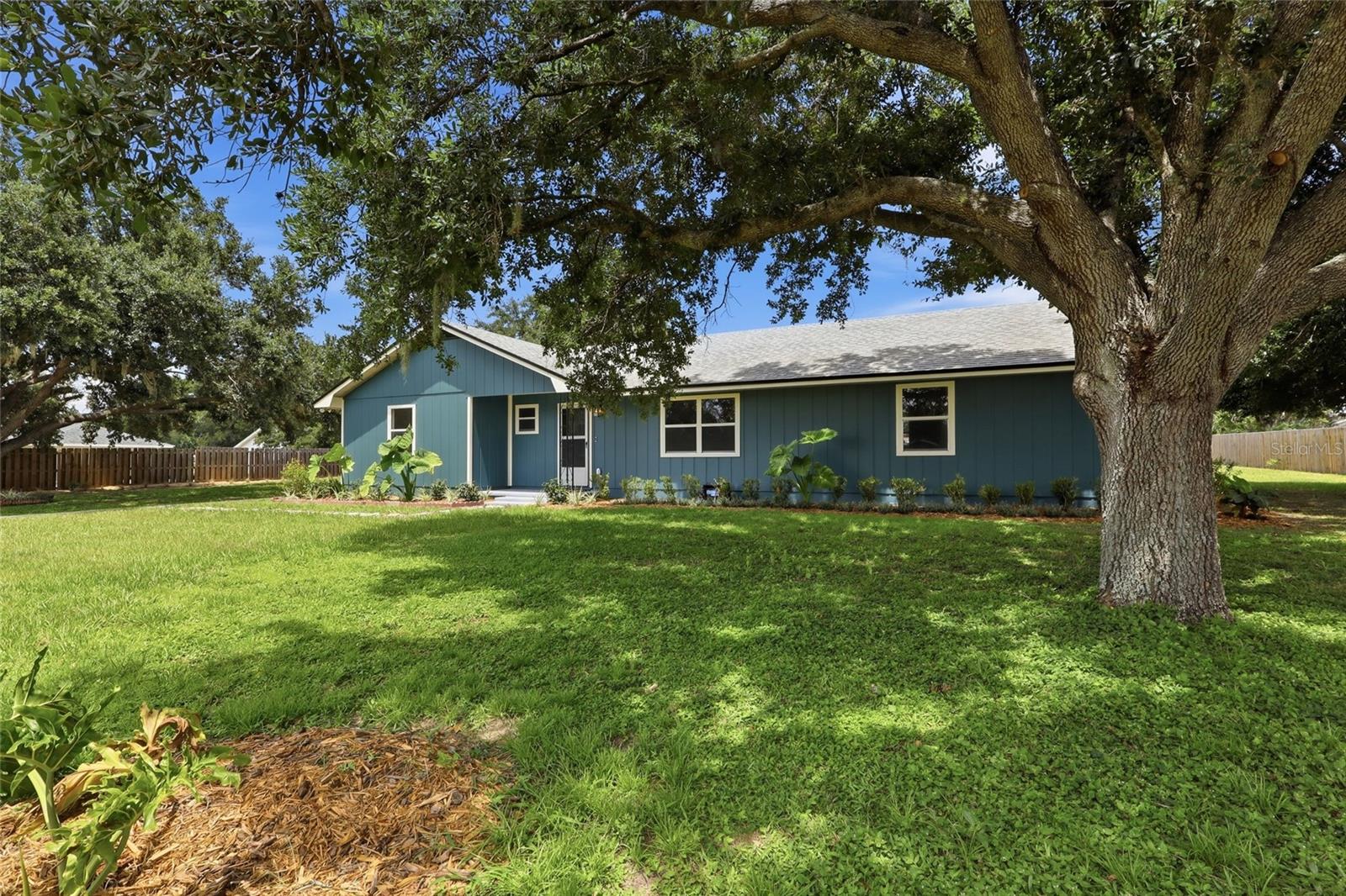 Newly remodeled and move-in ready, this 3 bedroom, 2 bathroom Lakeland home offers a sprawling .76 acre lot and the freedom of no HOA. Fresh interior and exterior paint, gorgeous wood look tile flooring throughout, updated light fixtures, and fully renovated bathrooms create a modern feel from the moment you step inside. The spacious floor plan offers room for everyone with both formal living and formal dining rooms, a bonus room that can be used as a home office or additional living area, and a separate dining space conveniently located off the kitchen. The thoughtful split bedroom layout provides added privacy, with the primary suite tucked away from the secondary bedrooms. Both bathrooms have been beautifully updated with new vanities and remodeled tub and shower areas. The kitchen sits at the heart of the home and flows easily into the surrounding living spaces, making it ideal for everyday living and entertaining. A separate laundry and utility room is conveniently located near the kitchen and primary suite and includes direct outdoor access. The property also features a large carport and a detached garage, providing plenty of room for vehicles, storage, hobbies, or workshop space. Conveniently located near shopping, dining, and major roadways, this home offers easy access to everything Lakeland has to offer. Don’t let this one pass you by!