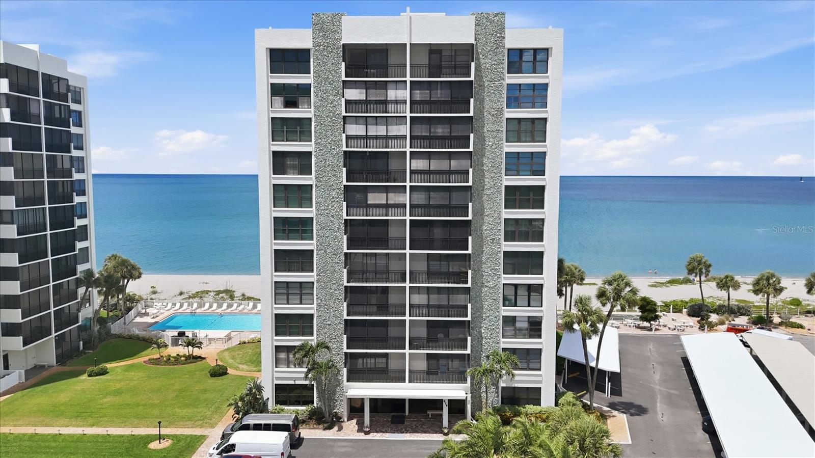 Beachfront Luxury at the Valencia Residences!
Welcome to your pristine beachfront retreat on Venice Island. Perched on the 7th floor and easily accessible via the building's private elevators, this 1,284 sq. ft. corner unit features 2 bedrooms, 2 bathrooms, and an open-concept layout flooded with natural light. Fully furnished, immaculately maintained, and turnkey ready.
Ocean Views: Custom mirror walls in both bedrooms reflect beautiful, partial Gulf vistas.
Indoor-Outdoor Flow: Double sliding doors open completely to an enclosed rear porch.
Modern Comforts: Newer windows, durable tile and laminate flooring, and an in-unit washer/dryer.
Parking & Storage: Includes one dedicated carport space and private outdoor storage.
Building Integrity: Completed engineer studies/SIRS reports and a newer roof.
Resort Living: Heated pool with beach access, fitness room, shuffleboard, secure entry, and on-site management.
Live like you are on vacation, just minutes from Historic Downtown Venice.