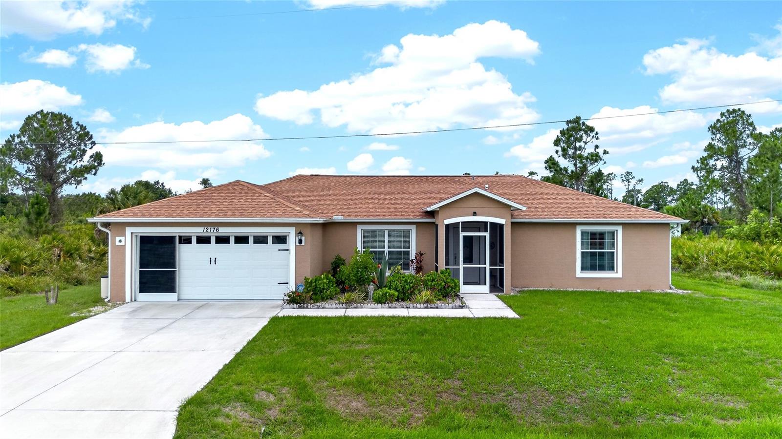 Welcome to 12176 Appleberg Circle, a 2018-built retreat in Port Charlotte, known for its fishing, Gulf access, and local charm. This 3-bedroom, 2-bath home boasts a bright open floor plan beneath soaring cathedral ceilings, seamlessly connecting the kitchen, dining, and living areas. Step outside to your heated saltwater pool, framed by a paved deck and covered lanai, ideal for relaxation. Enjoy a water filtration system, gleaming epoxy garage floor, and backyard shed. With a private, tranquil setting, this home offers a perfect blend of modern design and Florida living.