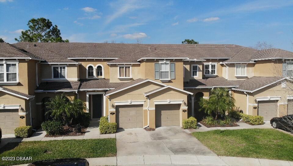 Welcome home! This well-maintained 3 bedroom, 2 1/2 bath town home is located on a cul-de-sac in the Landings of Sugar Mill. There is an open floor plan downstairs with a generous kitchen, dining and living area flowing onto the screened patio overlooking the pond. Upstairs you will find the inside laundry area, three bedrooms and two full baths. There is a one car garage to park the car, bikes or golf cart. The location of this home is close to all New Smyrna Beach has to offer - our beautiful beaches, the shopping and night life on Canal Street & Flagler Ave, I-95 access to three airports and the Central Florida theme parks and only 20 minutes from the Daytona Speedway. The low HOA fee covers use of the community pool and playground, lawn care, roof replacement and more. This home was used only seasonally for the last several years and is ready for new owners. Come take a look today! ;Water: City