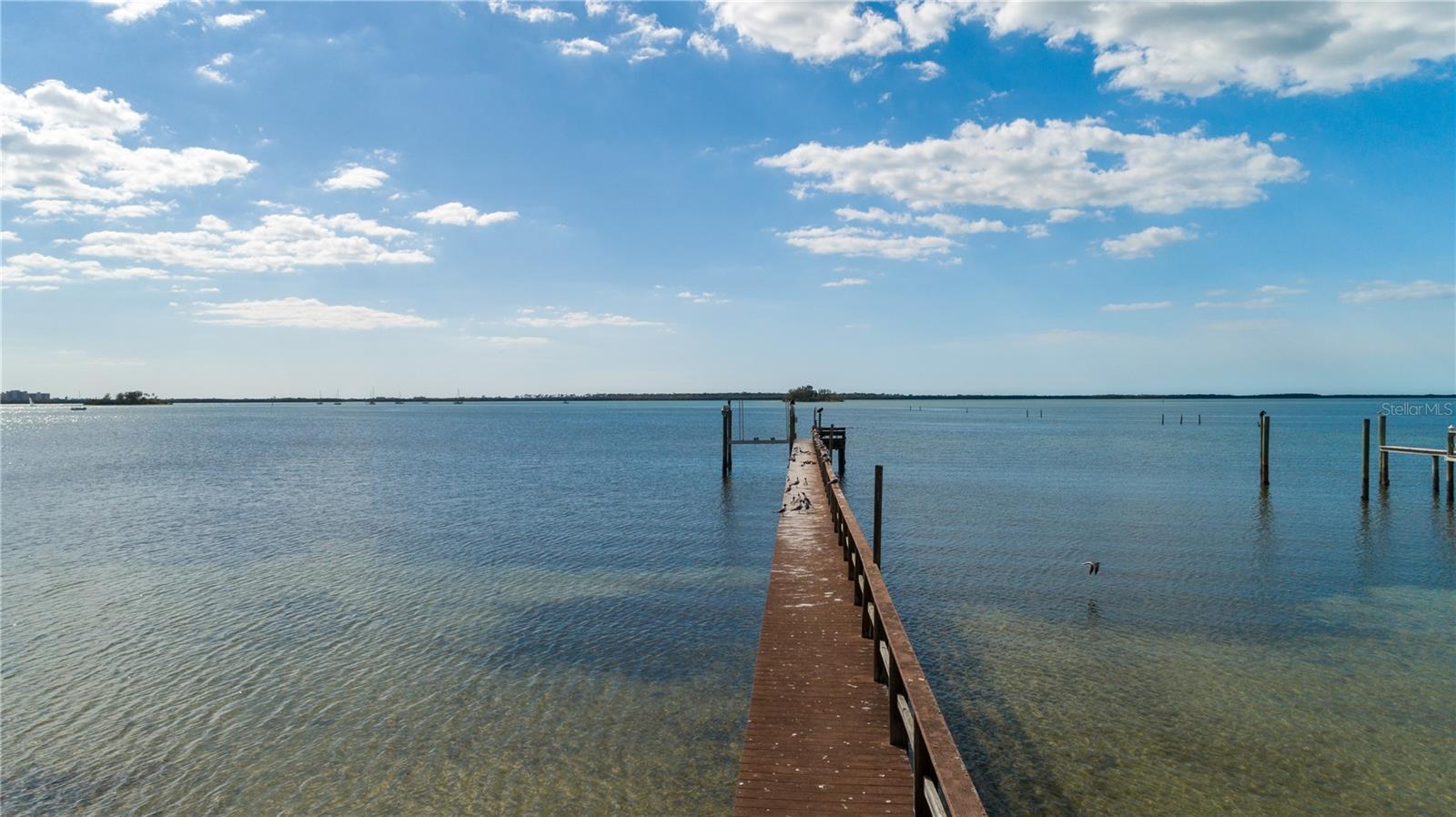 Victoria Drive!!!!! Very rare opportunity to live on the highly desirable Victoria Drive in Dunedin. This oversized lot has unobstructed breath taking views of the intercoastal water, gorgeous sunsets and wild life and Clearwater Beach North end. It has easy water access to the Gulf of Mexico in minutes. There is one existing boat dock with a 10K # lift (electricity required). One large private single family home can be built on this lot or up to 5 multi-family units could be build with City approval. Seller has preliminary city approval to build 4 units. Seller is willing to discuss selling plans and/or design build a home(s) on this lot for buyer. Deeded property includes submerged land not included in the total upland acreage quoted. Don't miss this once in a life time opportunity to live on Victoria Drive in Dunedin.