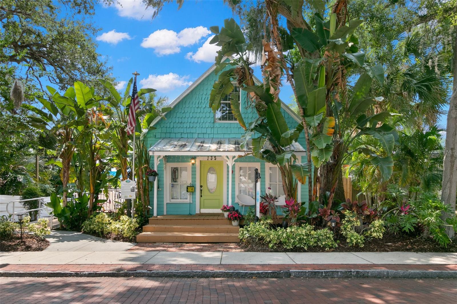 Welcome home to The Tupelo on 4th Cottage and Art Studio Property..... just behind the Gazebo!  This iconic Safety Harbor property offers a blend of Historic and New with an incredible location in the heart of Safety Harbor!  The charming 2-Story COTTAGE BUILDING (Approx 1,280 sq ft) fronting the 4th Ave N brick streets is a Wood-Frame Vernacular architecture structure featuring a wide front porch, wrap-around porch/Veranda, ADA Ramp/ Half Bathroom, and unique "fish scale" siding on the front gable - one of the most recognizable buildings in all of Safety Harbor.  This historic property was maintained as a private residence until 2012 when it was converted in to Commercial use.  For the last decade the front Cottage building as been used a LOCAL BOUTIQUE.   The back ART STUDIO BUILDING (Approx 840 sq ft) was built as an addition in 2014, and features separate entrance, 1 Office, Half Bath, Kitchenette area, high ceilings and large open space.  The two buildings are connected with an indoor hallway and also have separate entrances @ each end of the property.  MOSAIC BENCH:  The property is also home to a Custom 40-foot Mosaic Bench (with over 10,000 hand cut tiles!) inspired by Spanish Architect Antoni Gaudi'- a popular destination & photo location for Safety Harbor visitors.  Myriad of Permitted and Conditional Uses offering flexibility and possibilities for this space:  (MSM- Main Street Marketplace Zoning):  Possible Uses:  Residential, Multi-family, Art Gallery, Business and Professional Offices, Eating establishments/Taverns, Retail, Bed & Breakfast, etc.  Buyers of this incredible property will enjoy local customer base + increased Visitors and foot traffic on Safety Harbor Special events such as:  3rd Friday of every month (Evening Street Closure), Sip & Shop event, Sunday Markets next door at the Gazebo / 4th Ave N,  July 4th & December Holiday Parades, and other Special Events.  This unique property offers an amazing opportunity for the next Owner- please reach out for a private tour.
