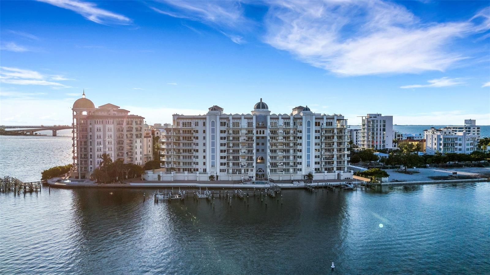 Breathtaking Panoramic Views in La Bellasara – Sarasota Bayfront Luxury Living – OFFERED TURNKEY FURNISHED

Experience the pinnacle of Sarasota luxury in this extraordinary 3,835 sq. ft. condominium at the renowned La Bellasara on Golden Gate Point. Designed with elegance and comfort in mind, this residence showcases breathtaking panoramic views of Sarasota Bay, the city skyline, and marina, offering a front-row seat to holiday boat parades and spectacular 4th of July fireworks. 

From the moment you step into the custom-designed elevator foyer, you are greeted with a sense of grandeur. The private elevator with keyless entry opens to a grand salon entry, setting the tone for the exquisite interiors that follow. 

This residence offers 3 spacious bedrooms with en-suite baths, each featuring built-in closets and private balconies, a media room, and a dedicated office/den with a top-quality built-in desk and credenza. The gourmet chef’s kitchen is a masterpiece, boasting custom cabinetry, granite countertops, walk-in pantry, instant hot/cold water dispenser, kitchen island with vegetable sink, and top-of-the-line appliances including a 6-burner Dacor gas stove, Dacor built-in oven, Dacor microwave and Sub-Zero refrigerator.    

The living room is designed for both comfort and entertainment, featuring custom built-in cabinetry, a wet bar, and wine refrigerator. Step outside to the 400+ sq. ft. balcony, complete with a summer kitchen featuring granite countertops and gas grill—perfect for entertaining against the backdrop of Sarasota’s dazzling sunsets. 

Additional highlights include a deeded 2-car garage with an additional storage room, ensuring both convenience and security.  Custom tray ceilings with accent lighting, recessed lighting, and audio surround sound create an elegant ambiance. Every detail has been carefully curated, with interiors professionally designed by Anne Folsom Smith, and the property is offered TURNKEY FURNISHED for effortless move-in. 

At La Bellasara, you’ll enjoy a lifestyle of resort-style amenities, including: Recently renovated heated pool and spa with stunning bay views, fitness center, movie theatre, and meeting & social room, 5-star concierge services from 7 AM – 11 PM 365 days a year, fishing and courtesy day dockage (private boat slips deeded/purchased separately), gated, and pet-friendly community  

All of this, just steps away from the vibrant energy of downtown Sarasota, where world-class dining, arts, entertainment, and shopping await.   

This rare offering at La Bellasara combines luxury, convenience, and unmatched views in one of Sarasota’s most exclusive communities.