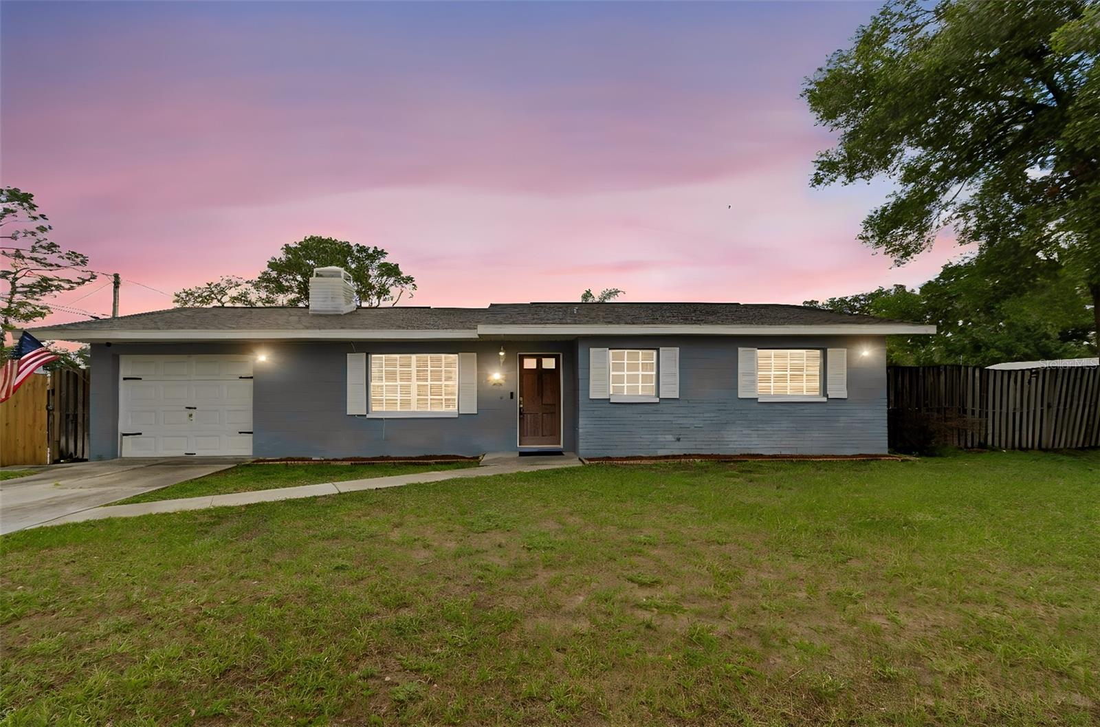Welcome home to this beautifully updated 3-bedroom, 2-bathroom residence situated on private land with the convenience of public water and a septic system. Inside, you'll find a thoughtfully renovated interior featuring luxury vinyl flooring throughout, an upgraded kitchen with granite countertops and modern finishes, and tastefully remodeled bathrooms.

The spacious living area is highlighted by a stunning brick accent wall and a cozy wood-burning fireplace, creating the perfect focal point for relaxing evenings or entertaining guests. The open and inviting layout offers comfortable living spaces filled with charm and character.

Step outside to enjoy your own private retreat. The property features a spacious side yard with a convenient drive-through gate, providing ample room for boats, RVs, trailers, or additional storage. The backyard is designed for relaxation and entertaining, complete with a beautiful in-ground pool surrounded by attractive pavers, creating the perfect setting for weekend gatherings and Florida outdoor living.

Enjoy the privacy and tranquility of your own property while benefiting from convenient access to nearby amenities. This move-in-ready home combines modern updates, outdoor enjoyment, and a quiet yet friendly neighborhood without deed restrictions or CDD fees!  Schedule your showing today!