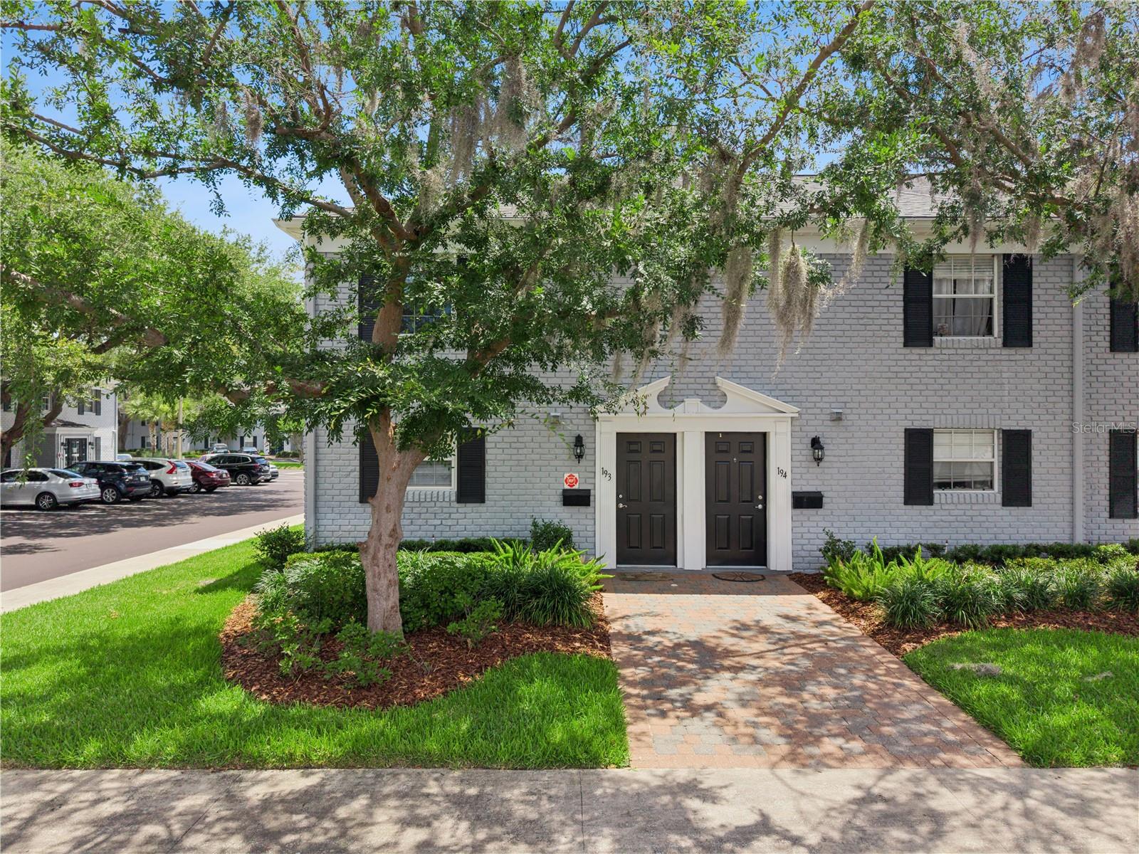 Welcome to 193 Lewfield Cir, Winter Park, FL 32792, a spacious two-story end-unit townhome offering 2 bedrooms, 2.5 bathrooms, and 1,300 square feet of comfortable living space in the Stratford A Winter Park Condo community. This 2-bed townhouse in Winter Park features an open floorplan with a large living and dining area, updated wood-look flooring throughout the main living spaces and bedrooms, recessed lighting, ceiling fans, and sliding glass doors that bring in natural light. The kitchen offers ample cabinet storage, stainless steel appliances, tile flooring, and a functional pass-through breakfast bar that opens to the main living area, creating a seamless layout for everyday living and entertaining. Upstairs, the oversized primary suite includes a walk-in closet, private en-suite bathroom, and generous floor space, while the secondary bedroom also features wood-look flooring, natural light, and easy access to the second full bathroom. Additional highlights include inside laundry, updated lighting fixtures, open parking, and plenty of storage throughout. Residents enjoy access to community amenities including a pool, fitness center, tennis courts, sidewalks, and maintained grounds, with HOA dues covering water, exterior maintenance, recreational facilities, and grounds maintenance. Conveniently located near Howell Branch Rd and SR 436, this Winter Park townhome provides quick access to shopping, dining, Downtown Winter Park, Maitland, Full Sail University, UCF, and Downtown Orlando. Located near highly rated Seminole County schools, parks, restaurants, and everyday conveniences, this property offers low maintenance living in a well-connected Central Florida location.