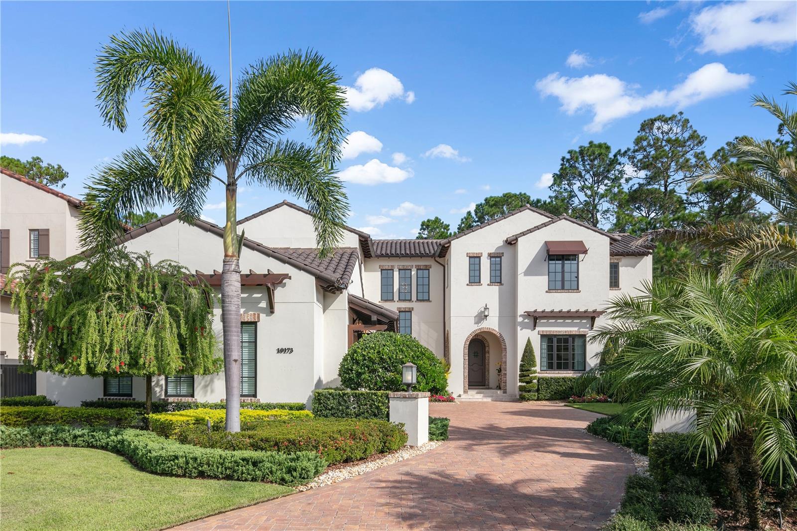 Ideally situated on an oversized lot in the Marceline neighborhood of Golden Oak at Walt Disney World® Resort, the timeless Mediterranean features of Villa Lucca blend harmoniously with the surrounding natural landscape. Upon entry, the eye is drawn through the spacious entry foyer to the sparkling pool and tranquil woodlands beyond. The great room opens to a sumptuous outdoor living area, creating a resort-inspired retreat perfect for effortless entertaining. Thoughtfully designed for comfort and flexibility, the home features two bedrooms on the first floor, including a serene owner’s suite with private pool access, and four additional bedrooms upstairs. Laundry rooms on both levels add everyday ease. Upstairs, a Star Wars–themed theater delivers cinematic fun. The home theater is complete with a built-in bar area, creating a seamless entertainment space for movie nights or game days. Throughout the home, subtle Disney-inspired touches add moments of magic and whimsy, elevating this alluring residence into a truly memorable retreat. Golden Oak at Walt Disney World® Resort is a residential resort community where families can live in the embrace of luxury, privacy and the magic of Disney. This gated community features distinctive neighborhoods of magnificent homes, expansive natural preserves and inviting amenities—including access to Golden Oak’s private clubhouse, Summerhouse, with superb food offerings served in a casually elegant dining room, courtyards, pool area, fitness facilities, and family room.  In addition, residents have access to Club Life, Your Special Connection to the Magic, including access to the Golden Oak Member Services team, park transportation, signature club events, theme park experiences, Extra Magic Hours and much, much, more.  Also at Golden Oak is Four Seasons Resort Orlando at Walt Disney World Resort, which hosts an 18-hole Tranquilo golf course, full-service spa, meeting facilities, and superlative restaurants.