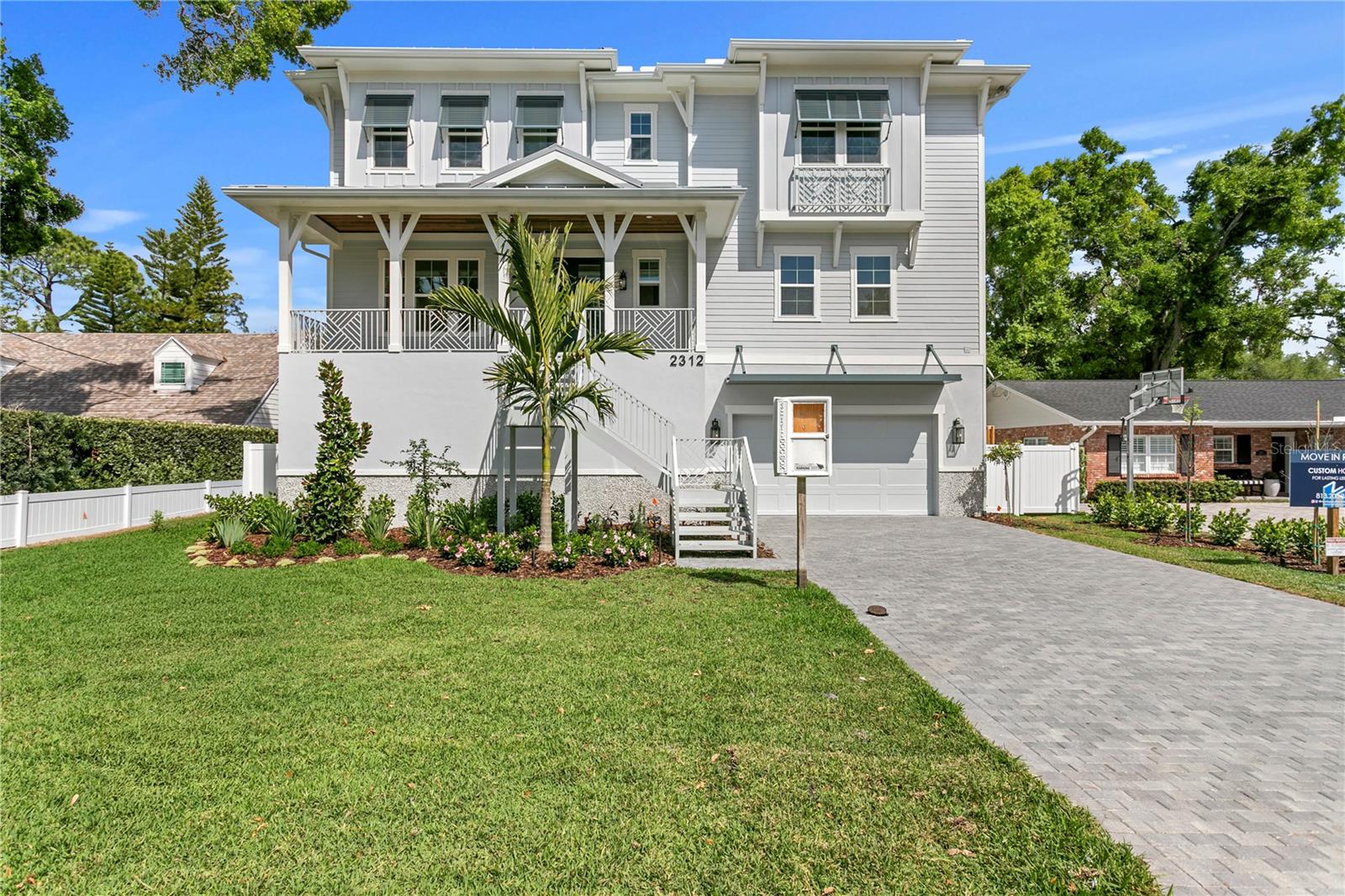 Newly Constructed. SUNSET PARK MASTERPIECE – YOUR NEW HOME AWAITS. Crafted by New Legacy Homes, this forthcoming 5,500+ square foot estate redefines luxury living in South Tampa’s coveted Mabry, Coleman, and Plant school district. Thoughtfully designed with five bedrooms, five and a half bathrooms, a media room, study, elevator, and expansive 2,000+ sqft flex space, this residence blends timeless architecture with modern functionality.
Enter through a grand two-story foyer, flanked by a refined home office and designer powder bath. The heart of the home showcases a chef’s kitchen outfitted with Thermador appliances, including a 48” gas cooktop with pot filler, dual ovens, and floor-to-ceiling custom cabinetry. A striking oversized island connects seamlessly to the breakfast area, formal dining room with a glass-enclosed wine display, and the spacious great room, which opens to a covered lanai with a fully equipped outdoor kitchen. A well-appointed prep pantry with a full-size secondary refrigerator and a large first-floor laundry room add both functionality and convenience. The first floor also features an expansive bonus room, currently staged with a ping pong table and sitting area, offering a versatile space for entertaining or relaxation.
Take the rear staircase or private elevator down to a one-of-a-kind under-home entertaining level with drive-through garage door access, offering over 2,000 square feet of flexible space beneath the elevated main living floor. The pool begins beyond the footprint of the home and extends underneath, creating a dramatic resort-style setting that remains shaded and enjoyable year-round. A dedicated turf area is already in place, ideal for a putting green, ping pong, or cornhole, with additional space for a personal gym or wellness features such as a sauna or cold plunge. Designed for both entertaining and everyday enjoyment, this level offers a truly unique extension of the home’s living space.
Upstairs, the primary suite is a true sanctuary, complete with tray ceilings, a spa-like bathroom featuring a soaking tub and walk-in shower, and dual custom walk-in closets, including a private primary closet with direct access to the second-floor laundry. Just outside the suite, a wet bar with a beverage fridge adds convenience and comfort to your morning routine or evening wind-down. Three additional en-suite bedrooms and a flexible bonus space complete the upper level, along with a second expansive bonus room featuring a full wet bar, ideal for entertaining, media, or additional lounge space.
Every detail of this home reflects quality, from impact-resistant windows and doors to a gas fireplace, smart home automation, solid core 8’ doors, level 5 smooth drywall, custom moldings, and energy-efficient construction featuring Icynene spray foam insulation and Hardie siding. Situated in the heart of Sunset Park, you are moments from South Tampa’s best boutique shopping, top-rated dining, waterfront parks, and Tampa International Airport.
This home is more than new construction, it’s the foundation for your next chapter of elevated living.