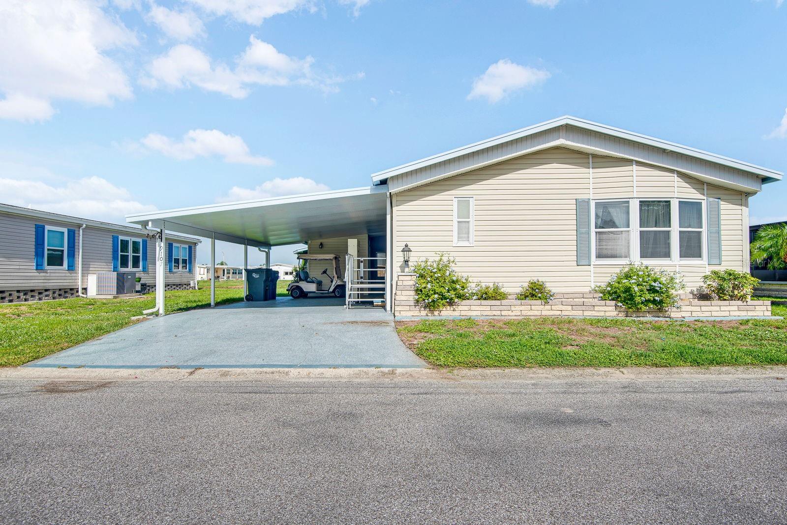 Virtually Staged. Welcome to 9107 34th Ave E in the desirable Piney Point 55+ community! This spacious home offers the perfect blend of comfort, convenience, and peaceful waterfront living. Situated on a scenic lakefront lot, you’ll enjoy beautiful water views from the bright and inviting sunroom—an ideal place to relax with your morning coffee or unwind at the end of the day.

Inside, the open floor plan provides an abundance of living space, creating a seamless flow that’s perfect for entertaining or everyday living. Brand-new carpeting adds a fresh, move-in-ready feel, while the newer tankless water heater offers energy efficiency and endless hot water. An electric handicap lift provides added accessibility and convenience.

Piney Point is a sought-after 55+ cooperative community offering an active Florida lifestyle with a low monthly HOA fee that includes many valuable amenities and services. Conveniently located near shopping, dining, medical facilities, I-75, and the beautiful Gulf Coast beaches, this home is an exceptional opportunity to enjoy affordable lakefront living in one of Palmetto’s most welcoming communities.