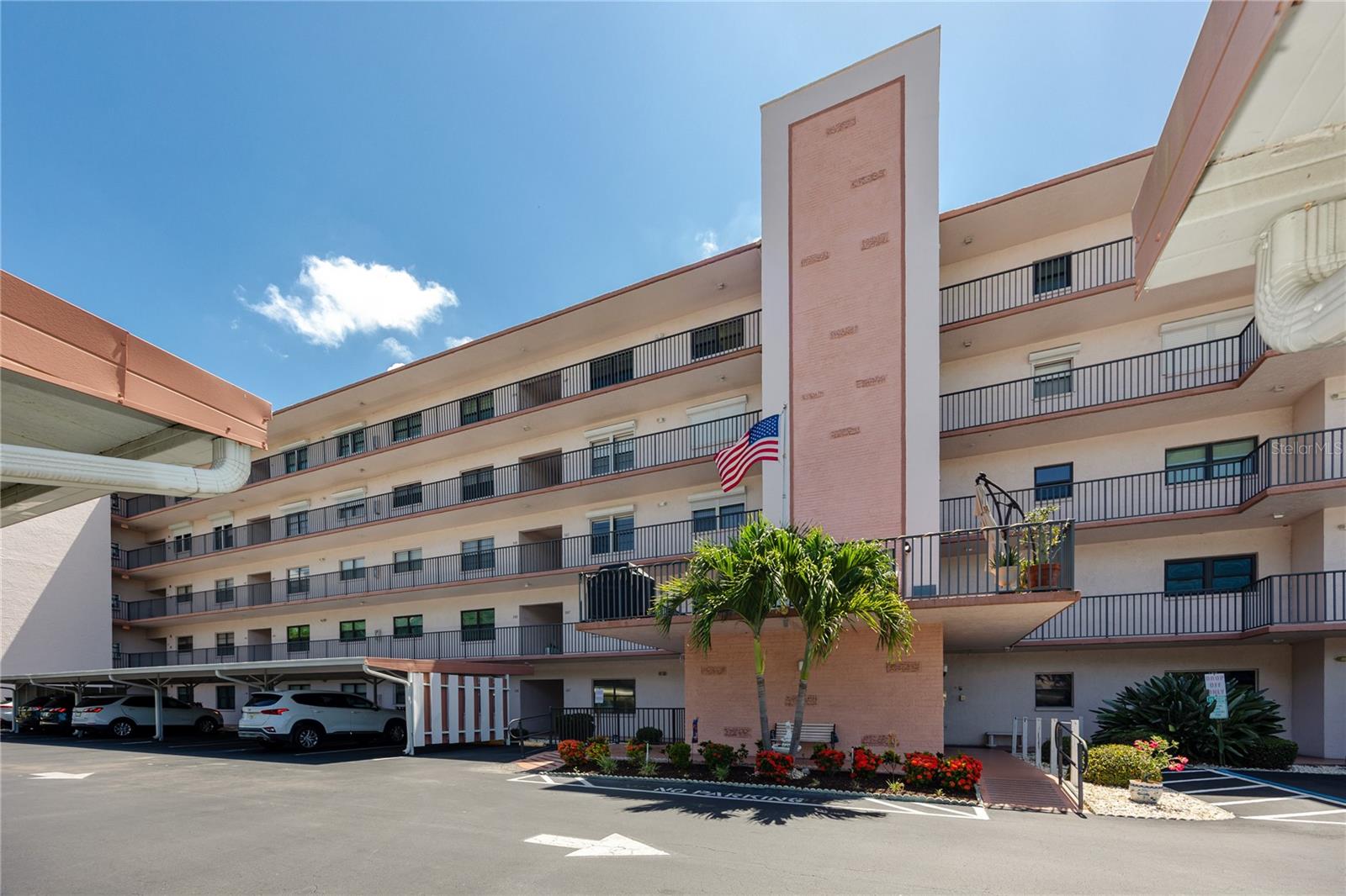 This 1,235 square foot, two bedroom, two bath condo in the Tiffany building at Five Towns offers the kind of easy, connected living that defines this 55+ St. Petersburg community. A private hallway entry opens into a spacious living and dining room built for entertaining or simply settling in. The galley kitchen is generously sized with a closet pantry for plenty of workspace, and just off the kitchen, a sitting room and breakfast area looks out over the pond and the wildlife that visits it, shaded each morning by a mature tree so coffee on a sunny day stays comfortable. Step through to the vinyl-enclosed balcony, where the view opens onto a landscaped lawn, the community's main pond, and its lighted fountain and walking path.
The split floor plan keeps the primary suite private in the back of the unit, bonus-sized with a walk-in closet and an ensuite bath featuring an oversized step-in shower, roomy enough for a caregiver if ever needed. The guest bedroom sits up front, generously proportioned, larger than many primary suites elsewhere, with its own full tub and shower bath, giving visiting family or friends a comfortable, separate space. An 8x10 laundry room with full-size washer and dryer adds everyday convenience and extra storage, and a covered parking spot is included with the unit.
The Tiffany building, completed in 1985, is one of the newer buildings within Five Towns and stands out for its secured lobby and well-kept community of neighbors. HOA dues run 856 dollars per month, right in line with the community's 600 to 962 dollar range, and cover cable television for two devices, sewer, trash, water, gas service for cooking and heat, high-speed internet, on-site security, and an escrow reserves fund that maintains the building exterior, grounds, and all recreational facilities.
Five Towns delivers an active, social lifestyle with six pools, a hot tub, two clubhouses, two fitness centers, tennis and pickleball courts, shuffleboard, billiards, card rooms, a library, bocce, horseshoes, a community walking trail, and a full calendar of clubs and social events, with additional amenity renovations planned across the community in the coming years.
This Five Towns home sits less than five miles from the VA Medical Center, Tyrone Mall, and Bardmoor Golf and Tennis Club, with easy reach of the Gulf beaches, downtown St. Petersburg, and an airport 25 minutes away. Worth a conversation, and worth seeing in person.