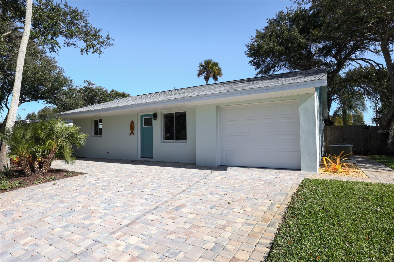 Immaculate block home a short walk to the beach and close to all beachside amenities. Meticulously renovated throughout with character and style. All major systems have been updated. Roof is 2020, AC 2021, hot water heater 2021, new appliances, electrical panel updated, new garage door, new irrigation system, new vinyl floors, new pavered driveway. Large kitchen island with plenty of seating and storage, plus breakfast nook or dining table space. Gorgeous bay window looking west from the living room perfect for enjoying colorful sunsets. Backyard is fully fenced, and boasts a shaded patio plus an extra storage room. Measurements are approximate. Square footage generated from recent survey, buyer to verify. ;Water: City