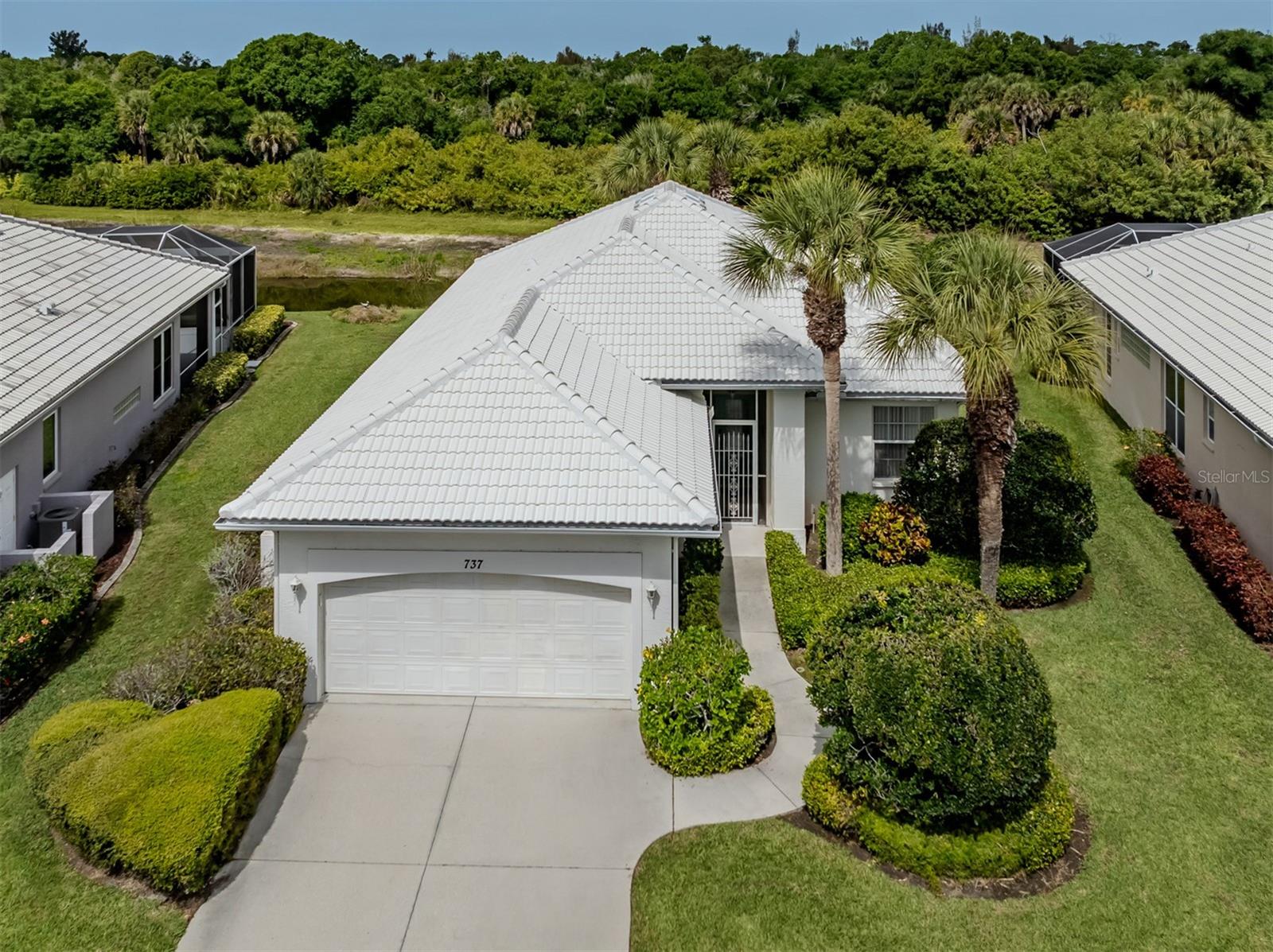 This J & J Built Quality home with LAKE-VIEW, the “GOYA” model features a NEW ROOF, AC and WATER HEATER, All the big ticket items have been done for the next homeowner. Even comes with a Whole House Central Vac System, and an Electronic hirricane shutter in the Lanai. A 2 Car Garage, a 20.8x20.8 large enough to fit a over size truck. 
All you need to bring is your remodeling and decorating skills.  I am hearing chatgbt will even help you. Home is located in a small community of Grassy Oaks, with only 30 houses. LOW HOA FEES OF $275.00 a month, that takes care of all your landscaping and street maintence. THE LOW MASTER ASSOC.FEE OF $295.00  a YEAR, includes a recipriolical with Lake of the Jacaranda swimming pool and clubhouse, and even includes the highly desriable PICABALL COURTS !!!. Location is Great !!! Only 6 miles to Downtown Venice and the Beach.  Pleny of RESTURANTS, STORES, and GOLF COURSES, surrounding the community. Seller to give credit for carpeting. 
The new downtown, WELLEN PARK is 5 miles away, giving you the opportunity to enjoy both downtown locations. Let's not forget about the other surrounding BEACHES, Nokomis, Englewood,and Casperson. If your a lover of the beach....this is the house for you!!! Stop on by and take a look for yourself!!!