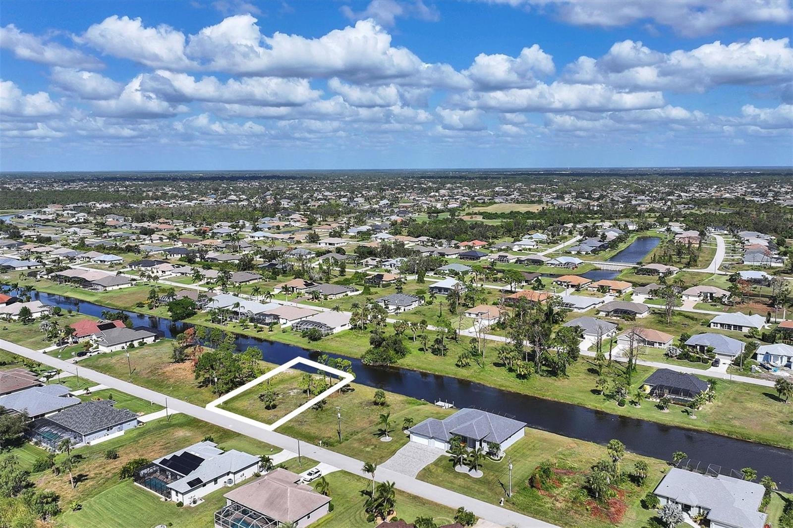Build the home of your dreams on this terrific waterfront home site, with plenty of builders to choose from and a quiet neighborhood to reside in. Go golfing at one of the 5 Premier Community Golf Courses, spend the day at a local beach or just relax at home. Shopping, golfing, live entertainment, boat ramps, and local Gulf beaches are all just minutes away. Enjoy waterfront dining and beach relaxation close by at Boca Grande and Manasota Key. When it’s time to come home, relax in the quiet retreat you designed just for yourself! Don’t let this chance pass you by, call today to turn your dreams into a reality! Want a double lot? The adjacent lot (51 Tournament Road) is also for sale.