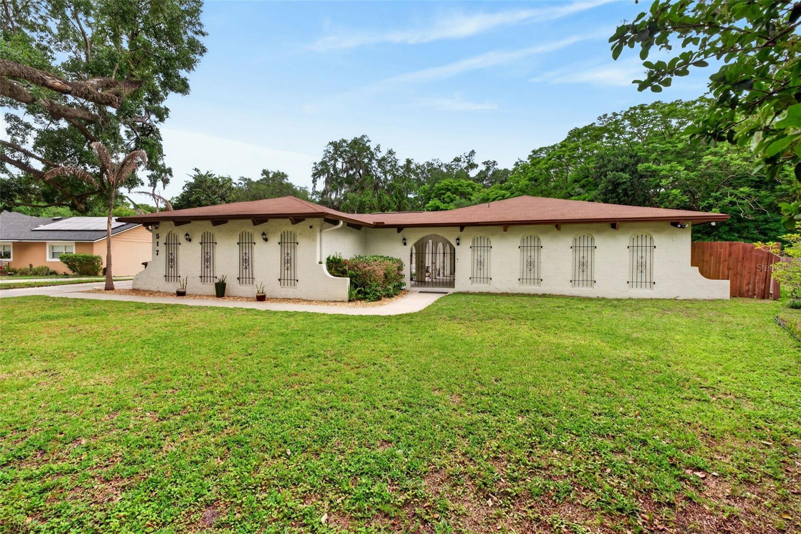 **SELLERS WILLING TO OFFER A CREDIT TO THE BUYER WITH A COMPETITIVE OFFER** Tucked along the peaceful banks of the Little Wekiva River, this four bedroom, two bathroom Spanish Mediterranean style home offers character, privacy, and everyday convenience. From the moment you arrive, the charming courtyard entrance sets the tone, welcoming you into a space filled with warmth, architectural detail, and timeless appeal.

Inside, arched doorways, a brick fireplace, and custom built-ins in the living room create a picture perfect setting, especially during the holidays. French doors open to both the courtyard and back porch, seamlessly blending indoor and outdoor living for effortless entertaining. The home offers a thoughtful layout with a perfect balance between open concept living and well defined spaces.

The kitchen features appliances updated in 2022 along with upgraded sink and modern hardware. Natural light flows throughout the home, highlighting updated light fixtures, ceiling fans, and a freshly repainted interior completed in 2026. New tile flooring has been added in the laundry room and Jack and Jill bathroom. 

This home uniquely offers two primary bedrooms, perfect for hosting guests or multi generational living. The main primary suite features private exterior access, a beautifully updated bathroom with soft close drawers, an upgraded medicine cabinet, and a newly custom designed walk-in closet.

Roof installed in 2017, HVAC from 2012, and a water heater replaced in 2014. The AC vents were professionally cleaned just six months ago, adding to the home’s well maintained condition.

Step outside to your own private retreat where a screened in porch overlooks the pool and spa, with the pool reaching a depth of eight feet. The fenced backyard offers both space and privacy, surrounded by beautiful mature oak trees in both the front and back yard that provide shade, comfort, and a true sense of Florida living.

Located just 7 minutes from I-4 and only 3 minutes from Costco, Target, Home Depot, and Walmart, convenience is at your doorstep, with Starbucks just a 12 minute walk away. The community is known for being warm and neighborly, where residents truly look out for one another.

With low HOA fees and a prime location near shopping, dining, and entertainment, this home offers the perfect balance of tranquility and accessibility. Schedule your private showing today.