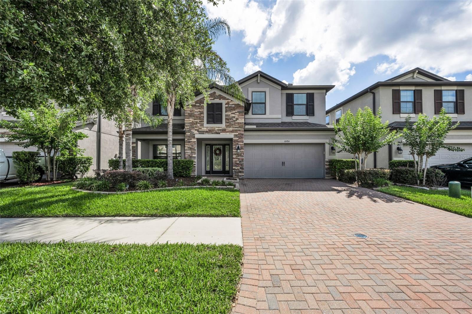Welcome to K-Bar Ranch! This beautifully maintained 4-bedroom, 3 1/2 bath, 2 Car Garage, Gated, Pool home offers nearly 3,000 square feet of living space and is loaded with thoughtful upgrades inside and out. Built in 2017 and situated on a desirable conservation lot with beautiful views of the pond and nature, this home combines modern comfort with exceptional outdoor living.  This spacious two-story home offers an ideal layout for both everyday living and entertaining!  The first floor features a formal dining room, a huge family room, and an open-concept kitchen with a beautiful center island and separate eat-in area overlooking the sparkling pool.  A convenient half bath and laundry room complete the main level.  Upstairs you will find a generous loft that provides additional living space, along with the primary suite and 2 other bedrooms and a full bath.  The spacious private primary suite is designed for comfort and relaxation and offers lots of natural light. Outdoor living is where this home truly shines. Enjoy your private backyard oasis featuring a custom pool and screened lanai complete with an outdoor kitchen area, granite countertops, and awesome private views of the pond and nature.   Additional exterior improvements include a fully zoned irrigation system (on a well), professional landscape lighting, expanded flower beds, and fencing for added privacy.  This home also offers a freshly painted interior, updated lighting throughout the main living areas, luxury vinyl flooring upstairs, upgraded bathroom fixtures, and a spacious open-concept floor plan designed for everyday living and entertaining. The kitchen has been enhanced with stylish backsplash upgrades and newer appliances, including a refrigerator (2025), microwave (2024), and garbage disposal (2025). You will also find a Garage EV charging station, Elevated garage storage systems, UV light system added to the HVAC , Wall-mounted TV installation, and an Updated half-bath vanity and sink and so much more!  Located in the highly sought-after K-Bar Ranch community with convenient access to top-rated schools, shopping, dining, major highways, and everything the Tampa area has to offer.  This community offers a community pool, clubhouse, playground, pickle ball courts, and lots of sidewalks to enjoy those early morning walks.  This move-in-ready home offers the perfect blend of luxury, functionality, and outdoor Florida Living!  Don't wait to schedule your showing on this beautiful home!