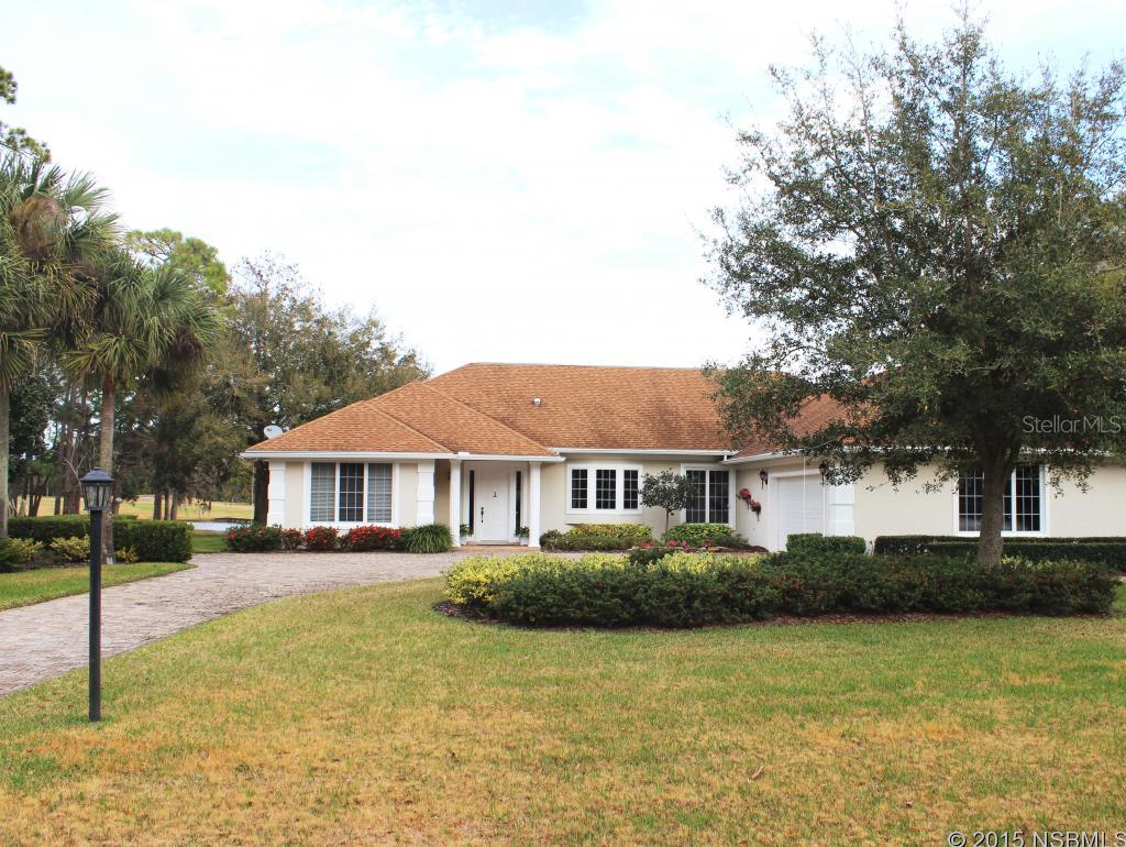 An amazing home on a lake with one of the most beautiful views of Sugar Mill Country Club is ready to be yours! This 3BR/2 bath, 2 half bath has home has a great open floor plan with split bedrooms. A beautiful stone wall with a gas fireplace and of course that awesome view awaits!  The kitchen adjoins both the formal dining room and living room has wonderful granite countertops and a separate eating area. The spacious master has sliders that overlook that great water view. It also features a spacious office, large walk-in closet, a half bath, and the master bath.   The guest wing of the home includes 2 large bedrooms, a half bath and a full bathroom. The 2 car garage also has a separate entrance for your golf cart and room enough for a shop. The drive way is covered by pavers. One visit to this home and you'll want it to be yours! ;Water: City