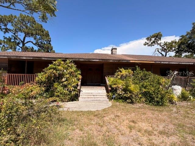 Investor Special – Unique Opportunity in Sarasota! This is more than a home—it’s your chance to create something truly special. Situated on an expansive 33,949 sq ft lot (that’s over ¾ of an acre!), this 3,650 sq ft property is brimming with potential. Inside, you’ll find 5 spacious bedrooms, 2.5 baths, 3 office/den spaces (one of which has a skylight) and multiple living areas—plenty of room to make it your own. There is a stunning cathedral ceiling that fills the space with natural light.  
The outdoor space is just as impressive. The large pool, perfect for swimming laps or relaxing with friends and family, is complemented by updated equipment and a resurfaced finish. Love tropical fruit? Your private oasis features mango, avocado, moringa, calamondin and elderberry tree.  Plus, with no HOA restrictions, you’ve got the flexibility to park an RV, build another residence, or even craft an outdoor paradise.
This home already has solid improvements, including a newer roof (2019), two AC units (2019), and hot water units replaced in 2023. Real hardwood floors add a timeless touch, and the wrap-around porch is as charming as it gets. While the home is fully hooked up to sewer, it’s also equipped with well water and while the electrical system dates back to 1991, this property is priced to reflect its potential—perfect for a flipper or dream-home renovator. 
This ideal location will provide easy access to Downtown Sarasota and the many dining, arts, cultural and shopping options.  Easy access to Sarasota Bradenton International Airport, UTC Mall, Mote Science Education Aquarium, and many of the west coast beaches including Siesta Key and Lido Beach, this tropical haven is waiting for you. Schedule your tour today—opportunities like this are rare!
