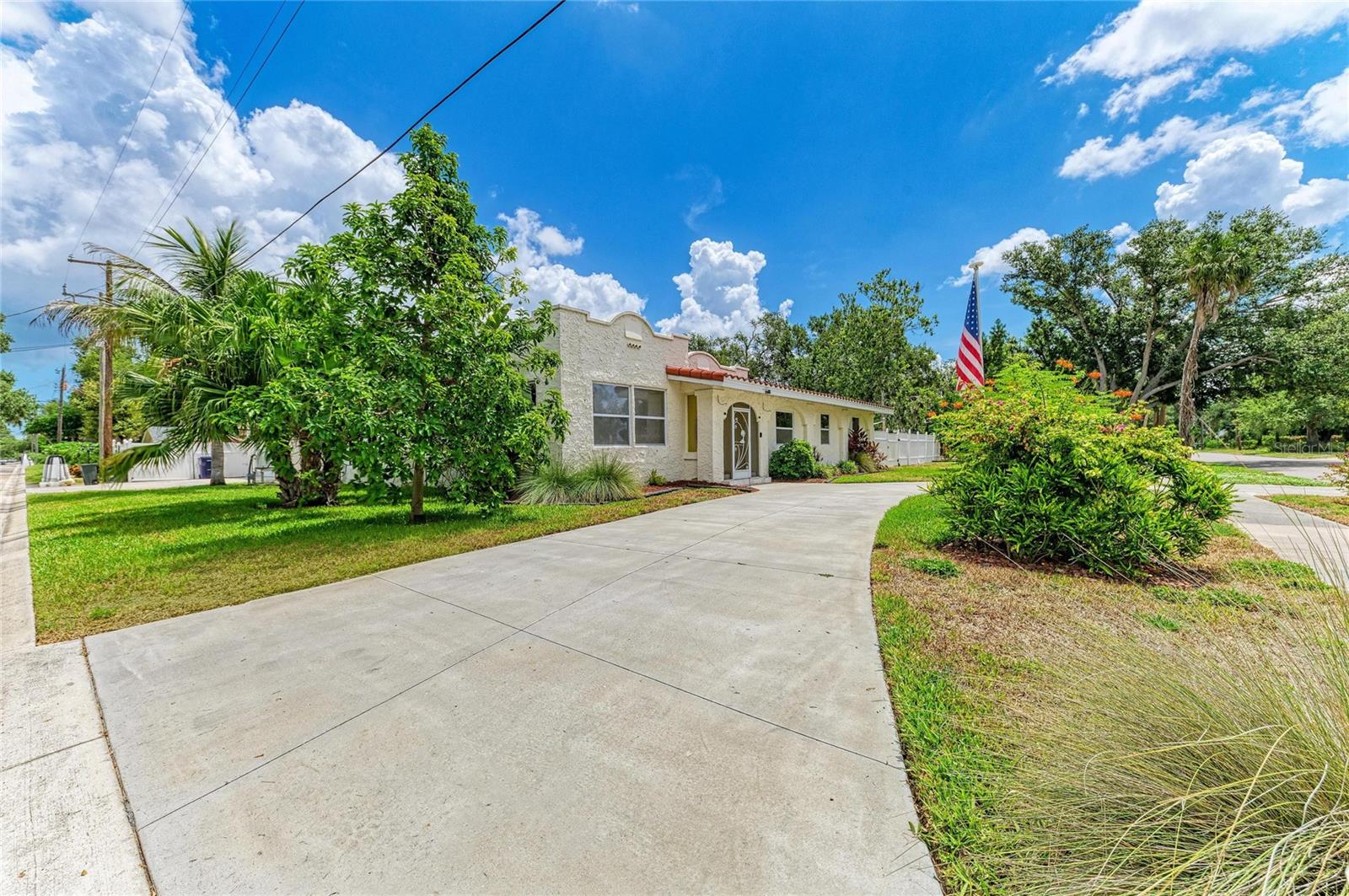 Set on nearly four-tenths of an acre beneath mature oaks in one of West Palmetto's most established neighborhoods, this beautifully renovated residence blends timeless character with modern design just minutes from the Manatee River. Offering approximately 2,400 square feet, the home has been thoughtfully transformed into an inviting space designed for everyday living and unforgettable entertaining.
The open floor plan centers around an expansive chef's kitchen featuring custom cabinetry, granite countertops, stainless appliances, oversized island seating, abundant storage, skylights, and beautiful architectural details that flow seamlessly into the great room. Coffered ceilings, a wood-burning fireplace, custom built-ins, and walls of glass create warmth while filling the home with natural light. The primary suite is a true retreat with a spa-inspired bathroom, oversized custom walk-in closet, and generous proportions rarely found in homes of this era. Two additional bedrooms provide flexibility for guests, family, or a dedicated home office. Step outside and discover why this property is so special. The oversized screened lanai surrounds a sparkling pool with expansive brick paver decking, creating multiple outdoor living spaces for entertaining, relaxing, and enjoying Florida year-round. Beyond the pool, the fenced backyard offers exceptional privacy, mature landscaping, room to garden, play, or even expand your outdoor living vision. Located just minutes from Emerson Point Preserve, Regatta Pointe Marina, downtown Bradenton, waterfront dining, local coffee shops, and the beaches of Anna Maria Island, this home delivers the kind of lifestyle buyers move to Florida to find. Nearby Emerson Point Preserve offers kayaking, fishing, observation towers, walking trails, and wildlife viewing, while the Bradenton Riverwalk and downtown waterfront are just a short drive away.
