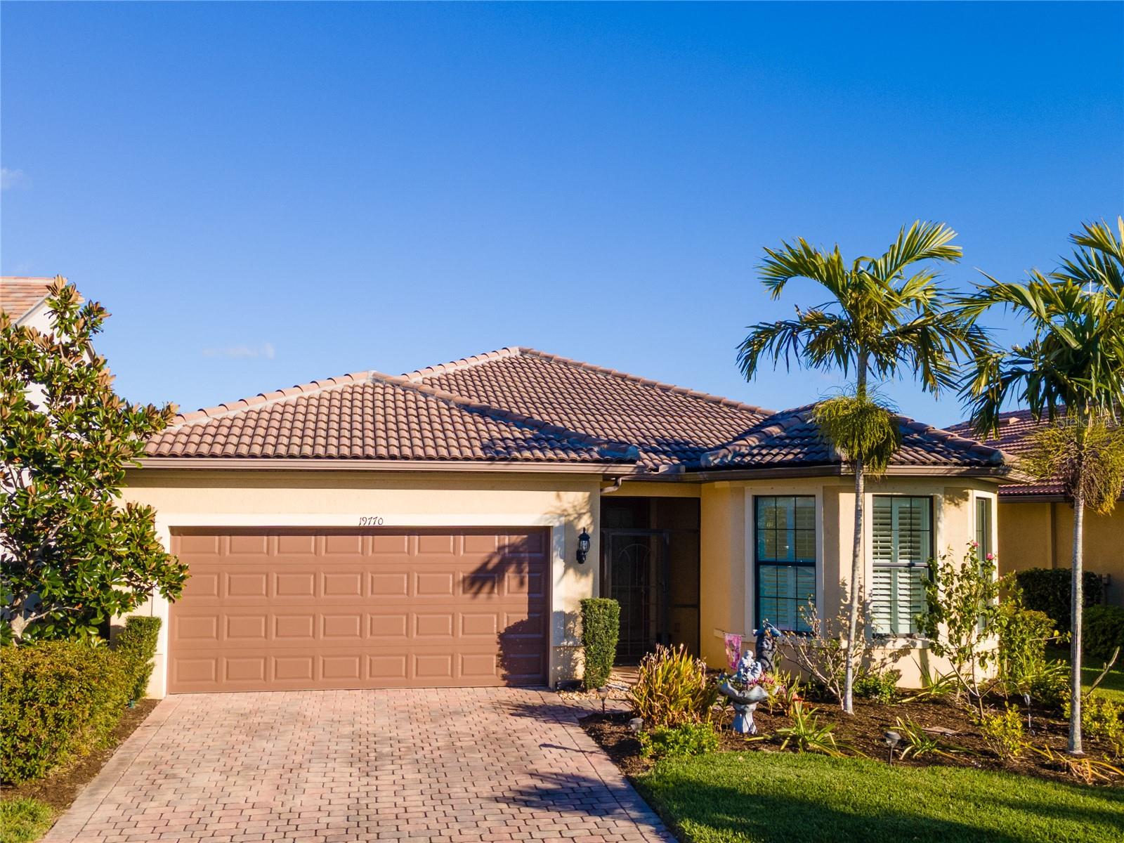 Wake up to serene lake views and unwind each evening from the large enclosed lanai, perfect for relaxing, entertaining, or enjoying sunsets year-round. This light and bright 2-bedroom, 2-bath home with a flexible den, located in a maintenance-free neighborhood, features tile flooring throughout and an open, airy layout that fills the home with natural light. A two-car garage adds everyday convenience and storage.
Set within a gated, amenity-rich community offering true resort-style living, residents enjoy an active lifestyle with a full calendar of social and recreational activities. Take advantage of resort-style pools, a fitness center, tennis and pickleball courts, playgrounds, and a dog park, all while enjoying the peace of mind of a manned guard gate. With lawn care included, you’ll have more time to explore nearby shops and restaurants or spend your days at Venice’s beautiful beaches—renowned for their pristine shoreline and world-famous shark tooth hunting. Whether lakeside, participating in community activities, or embracing the coastal lifestyle, this home delivers the ultimate in Florida living.