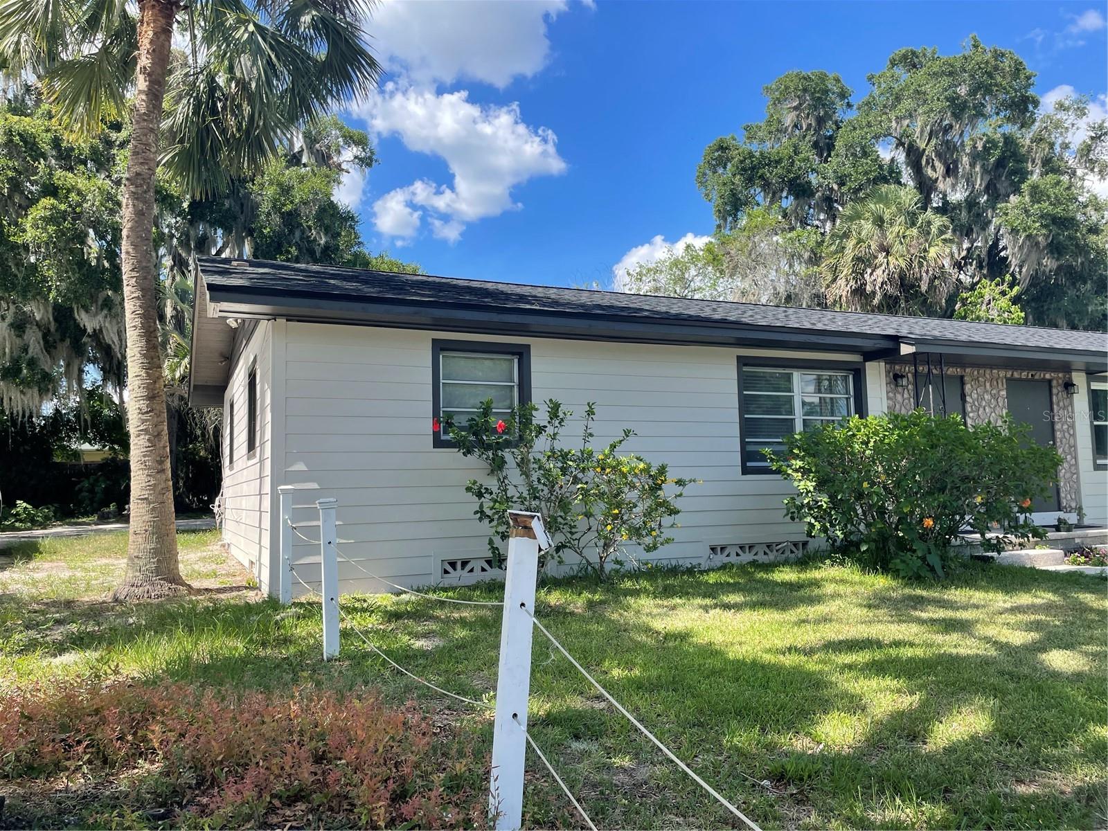 143 E. South Street, DeLand, FL 32724 is a duplex (2 units) on a 100’ x 100’ lot (~0.23 acres) in a highly walkable, in-town DeLand location—minutes to Downtown dining, Stetson University area, shopping, and major corridors with monthly gross cash flow of $2,535. The property offers a clean value-add / long-term hold play: stabilize operations, raise rents to market, and improve unit interiors/exteriors over time to drive NOI. With 1,817 SF total living area, you’ve got a flexible layout that can support strong tenant demand in the DeLand rental market. Property is ideal for investors targeting cash flow + appreciation in a central Volusia County location. Recent improvements included a new roof in 2021, window replacements, drainfield replacement.