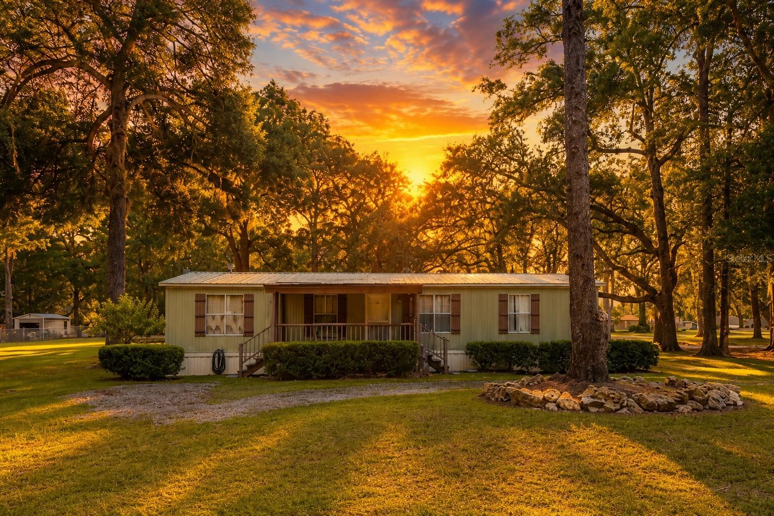 Discover the possibilities with this unique 2-acre property featuring two mobile homes, multiple outbuildings, and RV accommodations. The primary residence is a beautifully updated 3-bedroom, 2-bath double-wide offering new windows, new flooring, a one-year-old HVAC system, and a metal roof installed over shingles. The home includes all kitchen appliances, washer and dryer, a cozy fireplace, and a private fenced backyard with its own storage shed.

The second residence is a 2-bedroom, 1-bath single-wide with its own storage shed. While it could benefit from some updating, it offers excellent potential for extended family, guests, or investment opportunities (buyers should verify any intended use).

Additional features include a 14’ x 30’ workshop with a 30’ x 30’ awning, two 50-amp RV hookups, and plenty of room for equipment, hobbies, or outdoor living. A refrigerator located in one of the sheds is also included. An RV is available for purchase separately for $32,000 and is not included in the listing price.