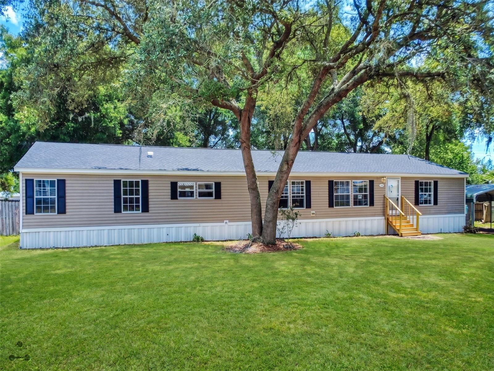 If you’re looking for a bit of country living with room to breathe, but still want to be close to everything Ocala has to offer, this home checks all the boxes. With plenty of space inside and out and major updates already done—new roof, new flooring, new stainless steel appliances, and HVAC (2022)—it’s ready to enjoy from day one.
The flexible layout features 4 bedrooms plus an office, giving you options for work, guests, or hobbies, along with both living and family spaces so everyone can spread out. The kitchen is a natural gathering spot with a large island with seating and glass-front display cabinets that add a nice touch.
The primary suite offers a comfortable retreat with new LVP flooring and a spacious en suite complete with dual sinks, separate tub and shower, private toilet room, walk-in linen closet, and a large walk-in closet. Three additional bedrooms are situated on the opposite side of the home for added privacy.
Cozy up in the family room with a wood-burning fireplace during cooler months or open the French doors and enjoy the backyard view. Outside, you’ll find a large covered back porch to relax on, a fenced yard, and a fire pit area—perfect for activities, grilling out in the evenings or entertaining friends. There’s also a storage shed next to the carport with plenty of space for bikes, tools, or outdoor toys.
Enjoy peaceful country living while still being just within 10- 30 minutes from some of Ocala’s best outdoor attractions, including Silver Springs State Park, Rainbow Springs, and miles of trails and recreation throughout the Cross Florida Greenway.
