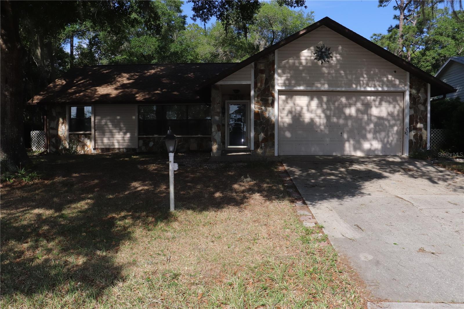 Very nice home with chain link fence in back yard. You have the best if both worlds with the National Forest behind the home and the community park across the street with no homes abstracting the view to the lake. This home had a family room with a gas fireplace and a sliding door that goes onto the 15 X 17 back porch. This home does have a split bedroom plan with nice size bedrooms.