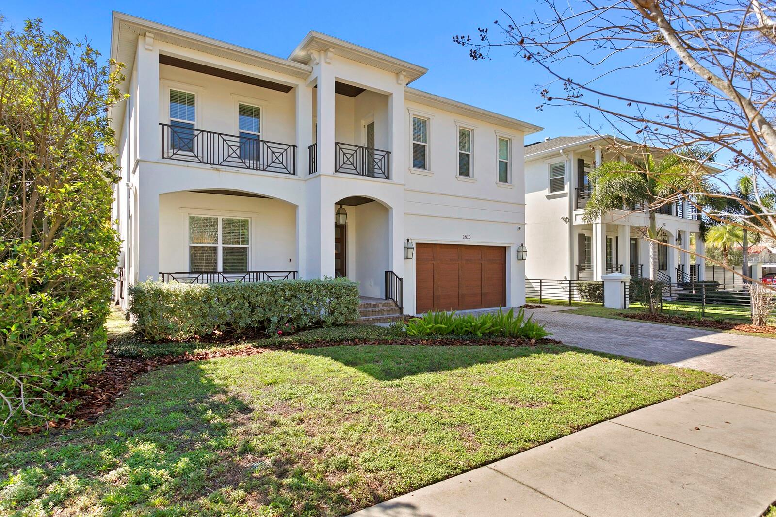 Come home to this coveted Bayshore location in close proximity to Bayshore Blvd. Enjoy nearby Bay views and light-filled living spaces in this 2017 built home, a spectacular tropical entertaining area, and expansive covered terrace and pool. Boasting 5 bedrooms, plus a bonus room, with dual primary suites, there is plenty of space for both living and entertaining. A sleek center island chef’s kitchen provides top-of-the-line Thermador stainless appliances and professional gas range, quartz counters/backsplash, a breakfast area and butler’s pantry. The first level also features a primary suite, great room and formal dining room. French doors lead to the covered terrace with outdoor kitchen and cypress ceiling, overlooking a pool with sun shelf and waterfall, along with a firepit and a fenced back yard with lush landscape. The second level provides a generous primary suite with sitting area and gracious bath with walk-in shower and a soaking tub, along with 3 additional ensuite bedrooms and a bonus room. Features and appointments include custom Shaker cabinetry with soft-close door/drawers throughout, Premium European wood flooring, 2 tankless gas water heaters, brick paver drive, 2-car garage, 2 story block construction, energy-efficient Low-E Impact windows and full security system. Immerse yourself in the South Tampa lifestyle convenient to The Stovall House Club. Near downtown Tampa, great restaurants, sports venues, Hyde Park Village, Channelside and more. Known as one of the longest continuous sidewalks in the United States, Bayshore Boulevard is 4.5 miles of scenic views paralleling Tampa Bay.