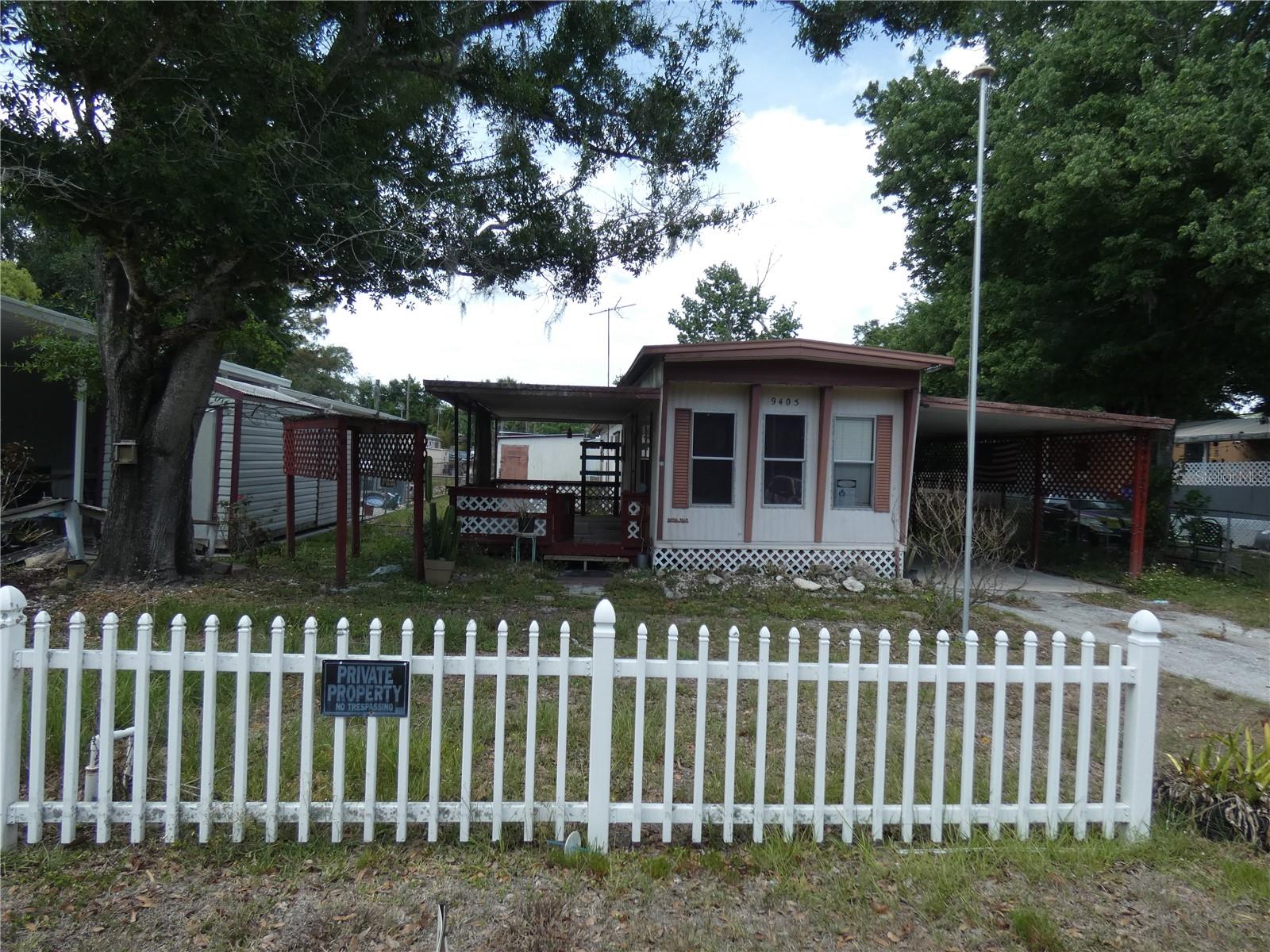 Affordable Mobile home and you own the land! No HOA or CDD fees.This mobile needs some TLC and has 2 Bedrooms, 1 bath with Laundry area too. Covered front porch, carport and two sheds, 1 AC unit. Conveniently located close to shopping and parks. Bonus room or office could be converted into 3rd bedroom. See it today, easy show.