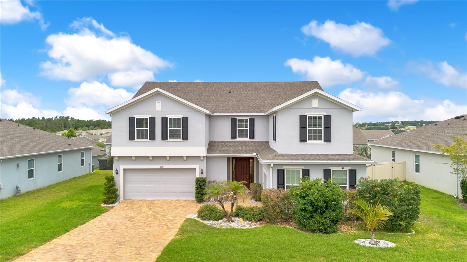 Looking for your ‘Resort-Style Pool-Home In The Hills’ just 20 minutes from Downtown Orlando? Welcome Home to 1321 Wildcat Lane.
Tucked into the rolling hills of Central Florida, this stunning almost 4600 sq ft, 5-bedroom, 3 full bathrooms with two 1/2 bathrooms home, has the rare combination of space, luxury, and an unbeatable location —  minutes from downtown Orlando and  world-famous theme parks like Disney and Universal Studios. Perched on close to a .25 acre lot, this property gives you room to breathe, entertain, and live the Florida lifestyle  that's nearly impossible to find this close to Orlando's best amenities.

Step outside to your own private oasis. The backyard is a true resort-style retreat, anchored by a sparkling pool and spa/jacuzzi — perfect for year-round sunny Florida afternoons, evening soaks under the stars, or weekend entertaining with friends and family. The oversized lot provides plenty of room to relax, eat, entertain, and plant, while making this backyard the heart of your everyday life.

Inside, the home is just as impressive. Make a grand entrance with two separate staircases to access your upstairs amenities (featuring upgraded railing), which adds architectural interest and effortless flow throughout the home. The gourmet kitchen is a showstopper, anchored by an amazing oversized island that opens directly into the family room and living area — the kind of open-concept layout made for hosting, cooking, and gathering. An amazing pantry adds extra storage, keeping the kitchen clutter-free and party-ready. The upstairs loft is great for billiards, movies, or anything you can dream of. The mudroom adds a quaint touch and did we add that there is a split three-car garage. Downstairs includes both a dedicated office and a separate den that can be used for gaming or converted into a library.

Upstairs (or tucked away), the primary suite is a true retreat, complete with a spacious sitting/retreat area, an elegant vanity, and the kind of comfort that turns a bedroom into a sanctuary.

Location, location, location. This home sits within a community offering its own pool and playground, giving you resort-style amenities right outside your door in addition to the private pool and jacuzzi at home. You're also just minutes from top-rated schools, entertainment, and shopping, making daily errands and school runs effortless — all while staying close enough to enjoy downtown Orlando and the magic of the area's amusement parks whenever the mood strikes.

This is more than a house — it's a lifestyle. Resort-style amenities at home, a vibrant community just outside your door, and the best of Central Florida minutes away. Homes like this — with this amount of space, this many upgrades, and this  location — don't last. Schedule your private showing today before this one is gone.