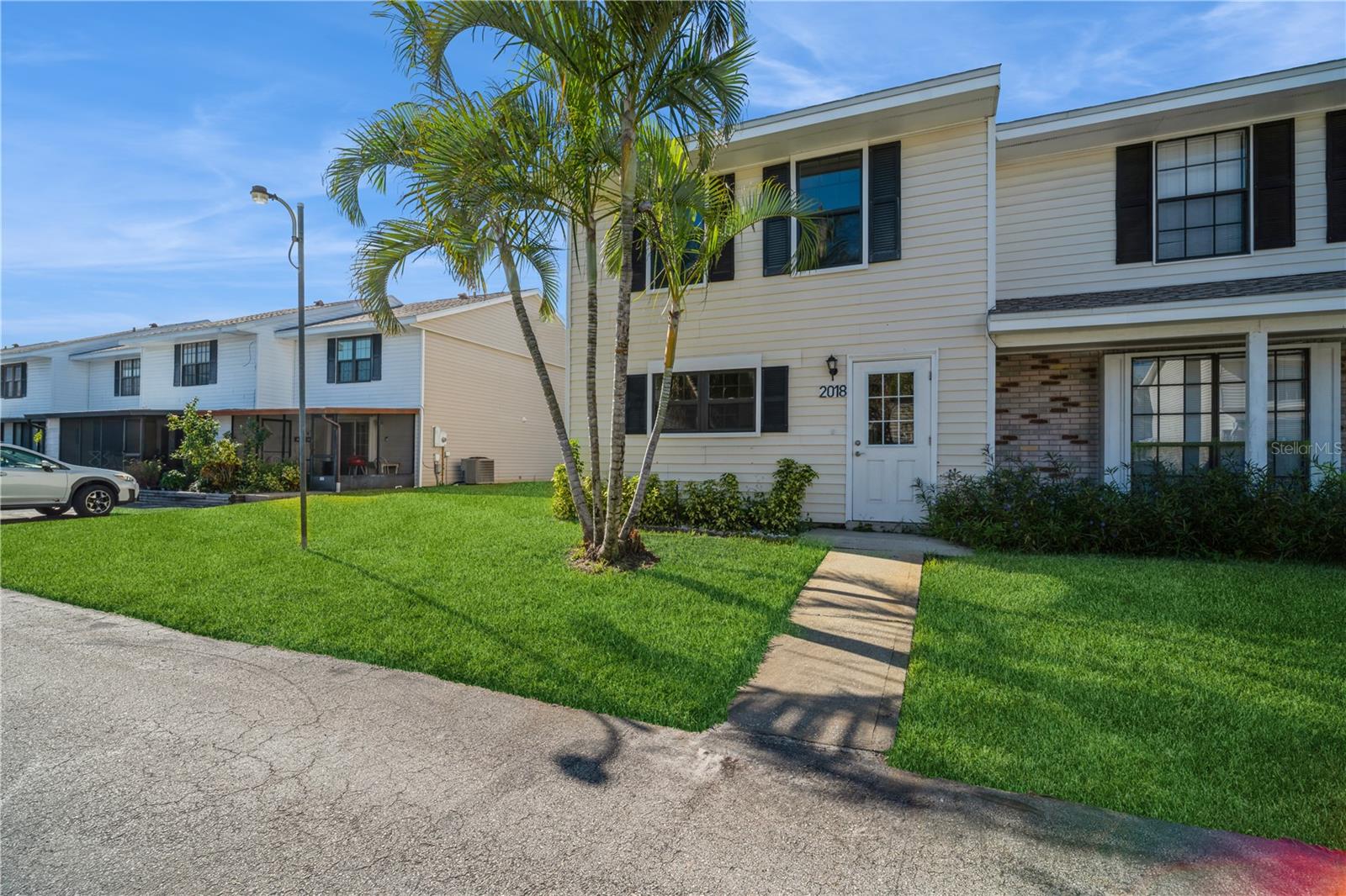 PRICE REDUCTION! Seller-completed appraisal in hand -- attractively priced for immediate interest! This beautifully remodeled end-unit townhome is move-in ready! Upgrades include brand-new stainless-steel appliances, modern kitchen and bath cabinetry with quartz countertops, and a new washer and dryer. Wood-look tile flooring throughout, recessed lighting, ceiling fans, and a tankless water heater enhance comfort and efficiency. Hurricane-impact windows and sliding glass door, plus a new roof and AC installed in 2021, provide peace of mind. Highlights: Two oversized bedrooms upstairs offer abundant natural light, and the screened-in porch sits just steps from the community pool. Location: Conveniently near major highways, grocery stores, restaurants, and shopping--only 15 minutes to the beach and about an hour from major theme parks.