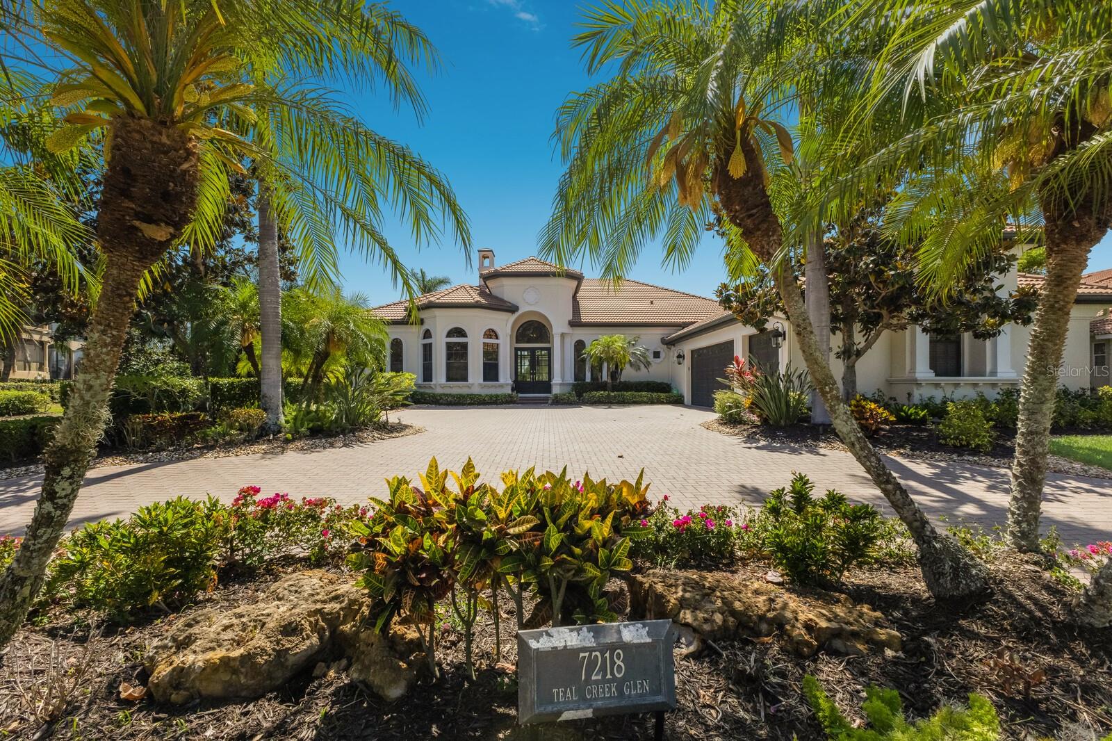 Experience the pinnacle of refined living in this exquisitely renovated 4,200 square foot home, perfectly situated in the exclusive Teal Creek enclave of Lakewood Ranch Country Club. Set on an expansive half-acre lot, the property enjoys a coveted west-facing orientation, offering sweeping panoramic views of the meticulously maintained golf course and a tranquil lake. This distinguished residence is a harmonious blend of classic sophistication and modern luxury, providing an ideal sanctuary for both relaxed family life and elegant entertaining.
Upon entering, you are welcomed into a thoughtfully designed open floor plan that effortlessly flows from space to space. With four generously sized bedrooms, three and a half beautifully appointed bathrooms, and a dedicated home office, the residence is as functional as it is stylish. At the heart of the home lies a breathtaking gourmet kitchen that would inspire any culinary enthusiast. Outfitted with sleek quartzite countertops, custom cabinetry, and premium Wolf and Sub-Zero appliances, this chef’s haven is as practical as it is visually striking.Throughout the four bedroom home, meticulous attention to detail is evident in every finish. Enjoy friends and family in chef's kitchen with quartzite counters, spacious island seating and ice maker!  Retreat to the Bonus room with wet bar and exoctic grantie counters.  The bonus room offers spectacular views of the sunset skies and may be converted to a fifth bedroom with the existing closet! already in place.  Engineered hardwood flooring and large-format porcelain tile lend warmth and elegance, while expansive sliding glass doors frame the picturesque outdoor scenery and invite natural light to pour in. The primary suite serves as a peaceful retreat, offering serene views, a spa-like bathroom, and two generous walk-in closets that provide ample storage and organization.Outdoor living reaches a new level of luxury with a private resort-style oasis that awaits just beyond the glass doors. A beautifully resurfaced pool surrounded by marble pavers, a spa, and a sun shelf create a relaxing and stylish atmosphere, all enclosed by new clear view screens to ensure uninterrupted vistas. An outdoor kitchen and spacious dining area make alfresco entertaining effortless, all set against the stunning backdrop of lush fairways and shimmering lake waters. For pet lovers, the large fenced-in yard provides a safe and spacious area for furry companions to roam freely. Adding yet another layer of comfort and charm, the south side yard features a cozy firepit seating area, perfect for enjoying cool Florida evenings under the stars. This remarkable home is more than just a residence—it’s an opportunity to embrace an upscale Florida lifestyle in one of Lakewood Ranch’s most desirable communities. This home also offers impact glass Sliding doors, impact front door, a Generac Generator that powers the entire home and a water filtration system! Enjoy extremely low HOA fees, this property offers stress-free, high-end living. Rarely does a home of this caliber become available, and with its prime location, thoughtful updates, and unmatched setting, this four-bedroom gem won’t remain on the market for long. Don’t miss your chance to make it yours