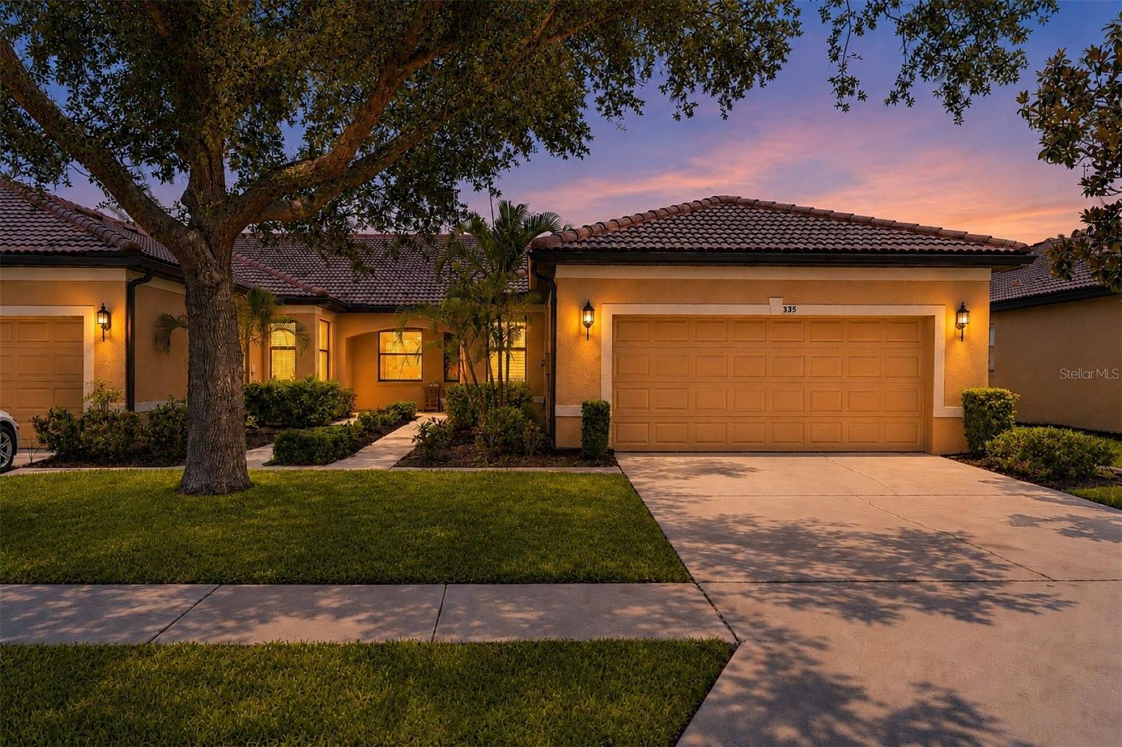 Tastefully updated and meticulously maintained, this turnkey end-unit villa showcases pride of ownership throughout and is available substantially furnished for an effortless move to Florida.   The home features hardwood flooring and tile throughout with no carpet, a beautifully updated kitchen with refreshed 42-inch cabinetry, granite countertops, stainless sink, pantry, breakfast nook, and new stainless steel appliances including a range with convection oven, microwave, refrigerator, and dishwasher. Additional improvements include a glass tile backsplash, HVAC system (2022), 40-gallon water heater (2022), updated lighting and hardware, plantation shutters and new paint throughout (2023), a screen door to the garage, and attractive stone flooring on the screened lanai (2022).
As an end unit, this villa enjoys an abundance of natural light thanks to numerous side windows not available in interior units. The spacious split-bedroom floor plan offers 2 bedrooms, 2 baths, a versatile den/office, formal dining area overlooking the living room and lanai, and a 2-car garage. The den provides flexibility for a home office, hobby room, reading retreat, or guest space. Multiple storage closets throughout the home provide exceptional storage.
Most furnishings, décor, housewares, and small appliances are included (personal items excluded). The thoughtfully selected furnishings blend high-end pieces with coastal-inspired design, creating a refined yet comfortable atmosphere that complements the Florida lifestyle.
Enjoy Florida's beautiful weather from the screened lanai overlooking mature landscaping or relax on the oversized covered front porch, which offers additional outdoor living space and could potentially be screened for year-round enjoyment.
Located within the gated 55+ community of Southshore Falls, residents enjoy a 14,000-square-foot clubhouse, three heated pools including a lagoon-style pool and resistance pool, fitness center, pickleball, tennis, bocce, billiards, library, arts and crafts studio, putting green, shuffleboard, cornhole, firepit gathering area, grilling stations, social clubs, organized activities, and more than 4.6 miles of walking and biking trails throughout the community. Conveniently located near shopping, dining, medical facilities, waterfront parks, boating, and Tampa Bay attractions, the community also offers easy access to Tampa International Airport, St. Pete-Clearwater International Airport, and Sarasota-Bradenton International Airport.
Whether you're seeking a full-time residence or seasonal Florida retreat, this exceptional villa offers the perfect blend of comfort, convenience, and active adult living.