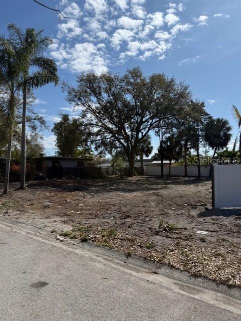 St Petersburg – Meadowlawn – this 75 x 100 vacant lot is the perfect blank slate to build your dream home. The lush tropical, and mature shade trees allow you to build while keeping the natural beauty and benefits. The previous house was demolished in November 2025. Water, Sewer, and Electric are on-site. Zoned AE Flood, but you can elevate out for no worries. This area is desirable as it is close to Downtown St Pete and an easy trip to Tampa via I-275. Close to shopping, restaurants, and entertainment – this area is up and coming for those in the know…