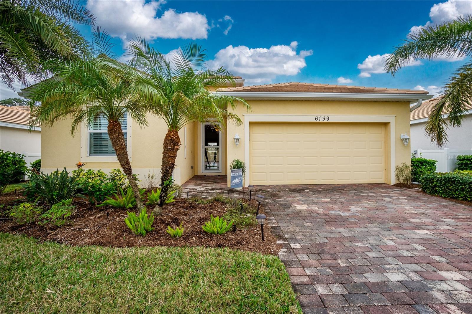 Experience the perfect blend of modern comfort, elegant design, and Florida living in this beautifully updated home located in the desirable gated community of The Villas at Charleston Park in Sarasota County.
From the moment you arrive, you'll be impressed by the home's exceptional curb appeal, featuring mature landscaping, a tile roof, a brick paver driveway, and a welcoming paver walkway leading to the inviting foyer. Inside, you'll find updated flooring throughout, fresh interior paint, plantation shutters, and crown molding that create a warm, welcoming atmosphere.
Designed with both everyday living and entertaining in mind, the updated kitchen is the heart of the home. It features stunning quartz countertops, a stylish tile backsplash, updated stainless steel appliances, abundant cabinetry, a walk-in pantry, tile flooring, and a large center island with a quartz sink and breakfast bar seating—perfect for gathering with family and friends.
The thoughtfully designed split-bedroom floor plan offers privacy and convenience with 4 bedrooms and 3 full bathrooms. The spacious primary suite includes luxury vinyl plank flooring, two walk-in closets, a ceiling fan, and a spa-inspired en-suite bath with dual vanities, a walk-in shower, and a relaxing soaking tub. Bedroom two is spacious and features its own private en-suite bath, making it an ideal retreat for in-law living and guests.
Step outside to your oversized 19' x 16' screened lanai, offering an exceptional outdoor living space for morning coffee, evening relaxation, or entertaining. The private backyard has space for a future pool, allowing you to create your own backyard oasis.
Additional updates include:
• Guest bathroom remodeled with a walk-in shower (2026)
• Water heater replaced (2026)
• Air conditioning system replaced (2022)
• No CDD fees
• Located in Flood Zone X
Residents of The Villas at Charleston Park enjoy a beautifully maintained, low-maintenance community featuring lush landscaping, scenic ponds with illuminated fountains, sidewalks, and charming lantern-lit streets. Resort-style amenities include a tropical swimming pool with sun deck, clubhouse, fitness center, library, billiards room, and social activities.
Ideally located in a peaceful country setting, yet just minutes from shopping, dining, and entertainment, this home is close to Wellen Park, only two miles from the Legacy Trail for biking and walking, and conveniently near golf courses, Gulf beaches, public boat launches, spring training baseball facilities, medical centers, schools, and everyday conveniences.
Whether you're searching for a full-time residence or a seasonal retreat, this exceptional home offers everything you need to enjoy the very best of the Florida lifestyle. Schedule your private showing today!