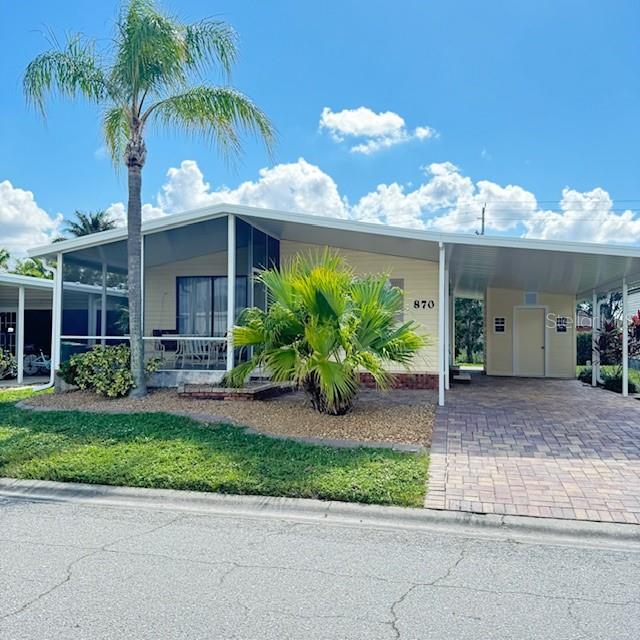 Welcome to paradise! Whether you are looking for the perfect seasonal escape or a year-round slice of heaven, this immaculate 2BR/2BA home in Maple Leaf Golf & Country Club is the one you’ve been waiting for.
From the moment you arrive, true pride of ownership is on full display. Upgrades throughout provide complete peace of mind: New Roof (2023)
 New Carport & Storage Shed (2024) Enclosed Screened Lanai, updated bathroom, and freshly painted. Featuring a charming brick paver driveway and fantastic curb appeal, this home is designed for the ultimate Florida lifestyle. Sip your morning coffee on the front lanai or host friends on your private patio. Best of all? You are just steps from a community pool, tennis courts, and a hot tub! arts & crafts, lawn bowling, Maple Leaf Estates It is a vibrant, award-winning, resident-owned 55+ community where neighbors become family. Your days can be as active or relaxed as you want with an on-site 18-hole executive-style course (Par 62), golf course, 4 pools, pickleball, tennis, a fitness center, pottery/woodworking shops, and 75+ social clubs. Wrap up your evenings with dinner and drinks at the community restaurant or the outdoor Tiki Bar! Live entertainment 
Bonus: This is a rare dog-friendly lot (allows 1 dog or indoor cat), and the price includes the community certificate share!
Don’t just buy a home—buy a lifestyle. Contact us today for a private tour of homes and community