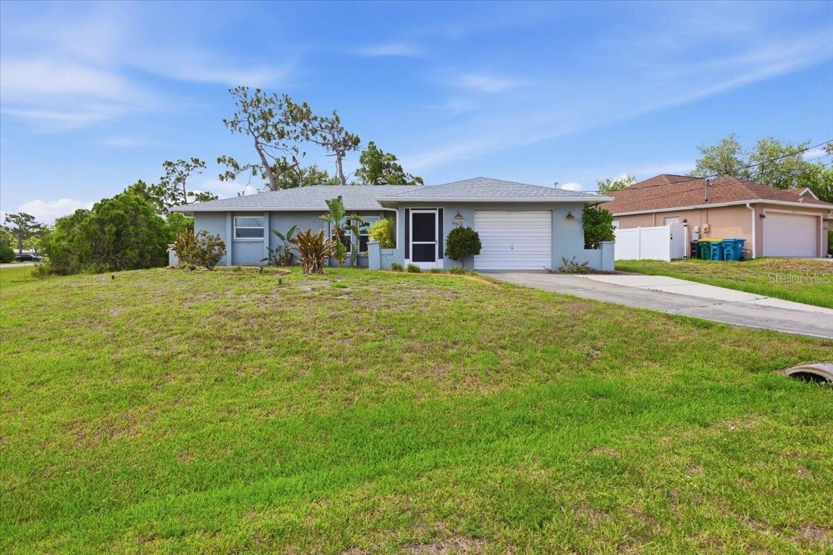 Short Sale. Do not miss this fantastic opportunity in a desirable Florida location, just 6 miles from Englewood Beach and the Gulf's turquoise waters and beautiful sandy shoreline. Situated on a generous 0.26-acre corner lot, this home offers great bones, numerous major updates, and only needs a little TLC to truly shine.

Peace of mind comes with big-ticket improvements already completed, including a NEW ROOF (2023), IMPACT WINDOWS (2023) (excluding the Florida Room), A/C (2024), and HOT WATER HEATER (2024). The open-concept living area creates an inviting space for everyday living and entertaining, while the kitchen features attractive butcher block countertops and stainless steel appliances.

The desirable split-bedroom floor plan provides privacy, and the updated primary suite includes a spacious walk-in closet. An air-conditioned Florida Room adds valuable flexible living space, perfect for a home office, hobby room, or relaxing retreat.

Outside, you'll find plenty of room to enjoy the Florida lifestyle, along with an air-conditioned shed that offers exceptional storage, workspace, or hobby potential.

Located in an X Flood Zone, flood insurance may not be required by your lender, providing additional savings and peace of mind.

Whether you're looking for a primary residence, seasonal getaway, or investment opportunity, this home offers a solid foundation, major updates, and an unbeatable location near beaches, boating, dining, and everything Southwest Florida has to offer.

Bring your vision and make this Florida gem your own!