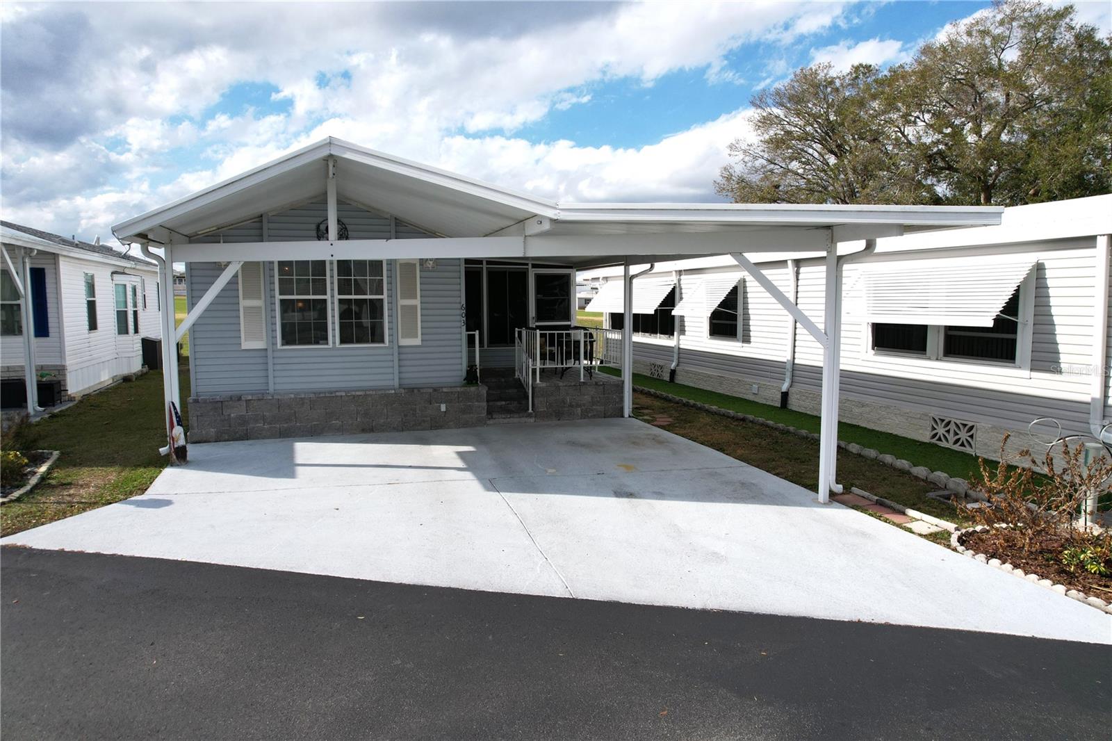 Welcome to DEER CREEK RV GOLF & COUNTRY CLUB!  It’s the perfect time to purchase your new FLORIDA GETAWAY!  Whether you are looking for a sunny place to winter or a full-time residency, this one-bedroom, one bath park model is perfect!  Located on the 7th fairway of the fabulous Deer Creek Golf Course! This TURNKEY GETAWAY features a spacious & airy Florida Room perfect for guests & is move-in ready! Your back patio is complete with pavers & is perfect for entertaining with family & friends or enjoying your morning coffee overlooking the golf course! The covered front porch is perfect for reading a book or visiting with neighbors. 10 x 12 Smith Built Shed with electric has plenty of storage for your golf clubs & pool toys! Located just across the street from the Eagles View Community Clubhouse, Pool & Shuffleboard Courts!  Eagles View has tons of fun activities in their updated clubhouse!  If you love RESORT style living, this is the place for you! DEER CREEK’S MAIN CLUBHOUSE offers a variety of social events throughout the year such as Karaoke Night, Group Exercise, Yoga, Line Dancing, Crafts, Swing Dancing & more!  Soak up the sun at Deer Creek’s MAIN pool, cabana & hot tub area! Try water volleyball, pickleball, tennis, shuffleboard or pool aerobics!  Love golfing? Check out Deer Creek’s 18 Hole Executive Golf Course, leagues, & shopping at Pro Shop! Rated #3 Most Improved Golf Course in the US by Golf Advisor (2015) with Power Tee automated teeing system.  The Tiki Bar is a great place to meet new friends with occasional live bands & music! The Greenside Grill is perfect for onsite dining!  Deer Creek is centrally located in Davenport just 20 minutes from Disney & all the attractions that families enjoy! Hop on your golf cart & ride to many restaurants & shops nearby. Bealls, Marshalls, Target & Star Bucks are in Posner Park less than a mile away! A new Publix is opening just across the street!  Ideal for full-time residency or seasonal getaways!  Call today to view this HIDDEN GEM in sunny Florida! Just 1.5 hours to each COAST! Looking for a slice of paradise?  Let us show you Deer Creek today!