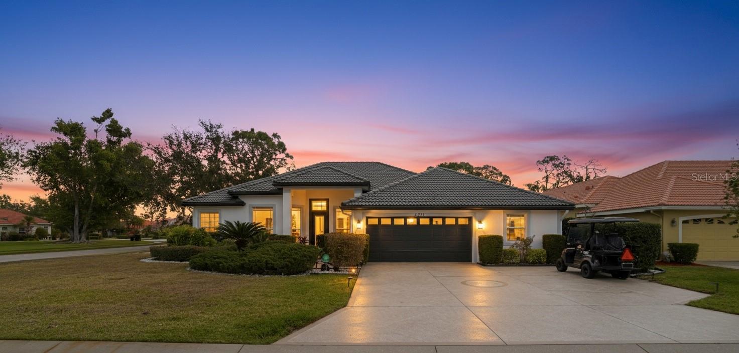 In the welcoming enclave of Arbor Lakes Estates at Mote Ranch, this custom-designed residence offers an expansive 2,800-square-foot sanctuary that masterfully balances architectural detail with unparalleled flexibility. On a sprawling corner lot with mature landscaping and attractive curb appeal, the home begins with an inviting front porch that leads into a thoughtfully designed open-concept floor plan. The heart of the home is a chef-inspired kitchen featuring sleek granite countertops and ample storage, which flows effortlessly into a sun-drenched breakfast room and a grand great room characterized by soaring ceilings and recessed lighting. For those who prioritize a seamless indoor-outdoor lifestyle, a massive wall of sliding glass doors retracts to reveal a private, hedge-screened pool and covered lanai, creating a secluded oasis for relaxation or large-scale social gatherings. The layout is arranged as a triple-split plan for maximum privacy, anchored by a massive main suite with generous walk-in closets and direct pool access, while the formal living room offers a footprint for a well-appointed home office. Perhaps the home's most unique feature is the fourth bedroom wing, which connects to a massive 20-by-10-foot bonus room with built-in cabinetry and its separate entry, providing a rare opportunity for a self-contained multi-generational suite, an art studio, a dedicated fitness center or spacious workshop. Beyond the property lines, the Mote Ranch lifestyle provides exclusive access to a community pool, playground, and a private kayak launch and fishing pier on the Braden River, all while being just minutes from the shopping at UTC Mall, the fitness and golf at Palm Aire Country Club, and the vibrant recreation of Nathan Benderson Park.