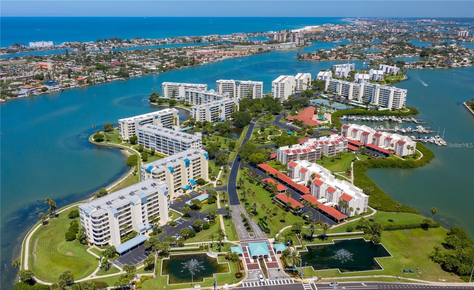This is a well maintained waterfront unit in Harbourside Condos in South Pasadena including a deep water boat slip/lift (there are only 87 slips total for a complex of over 800 units). It's a 16,000 lb Deco all aluminum and stainless steel cradle lift.  Harbourside is a resort-like condo community on the intracoastal waterway 5 minutes from St Pete Beach. This unit's features are: HVAC system (2025), Stainless steel appliances, Hurricane shutters, Hurricane impact windows, 9' Ceilings and Dining and Living room combination with a Split Bedroom plan. The western view from the private balcony has beautiful Florida sunsets! The guest bedroom and kitchen also have beautiful water views. Harbourside is a guard gated (24 hour) complex with many amenities including 6 pools, his and hers fitness centers, shuffleboard, pickleball, tennis, hot tub, electric car charging stations, car wash stations, clubhouse with many social events throughout the year, library, card room, billiards room, arts and crafts room, wood working area, yoga and water exercise classes. There is a 1.5 mile walkway around the complex along the waterfront which is lit up for nightly walks. Come see what resort living in Florida is all about. You can live your tropical, island dream here in Harbourside.