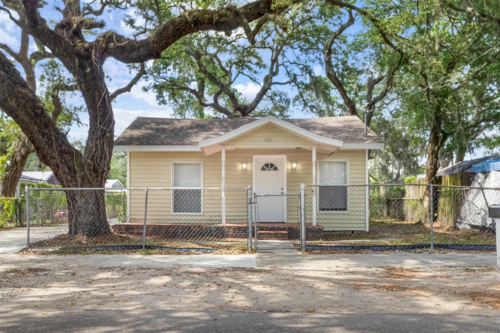 Welcome home to this beautifully updated residence located at 2116 E Ellicott Street in Tampa. Freshly renovated and move-in ready, this charming home features brand-new laminate flooring and fresh paint throughout. The updated kitchen is equipped with new appliances, offering both style and functionality for everyday living. Enjoy a spacious floor plan with comfortable living areas and generously sized bedrooms. Enjoy your large backyard and fully fenced property. Conveniently located near downtown Tampa, Ybor City, major highways, shopping, dining, and entertainment, this home provides easy access to everything the Tampa Bay area has to offer. Don't miss this opportunity to lease a freshly updated home in a convenient Tampa location. Schedule your private showing today!