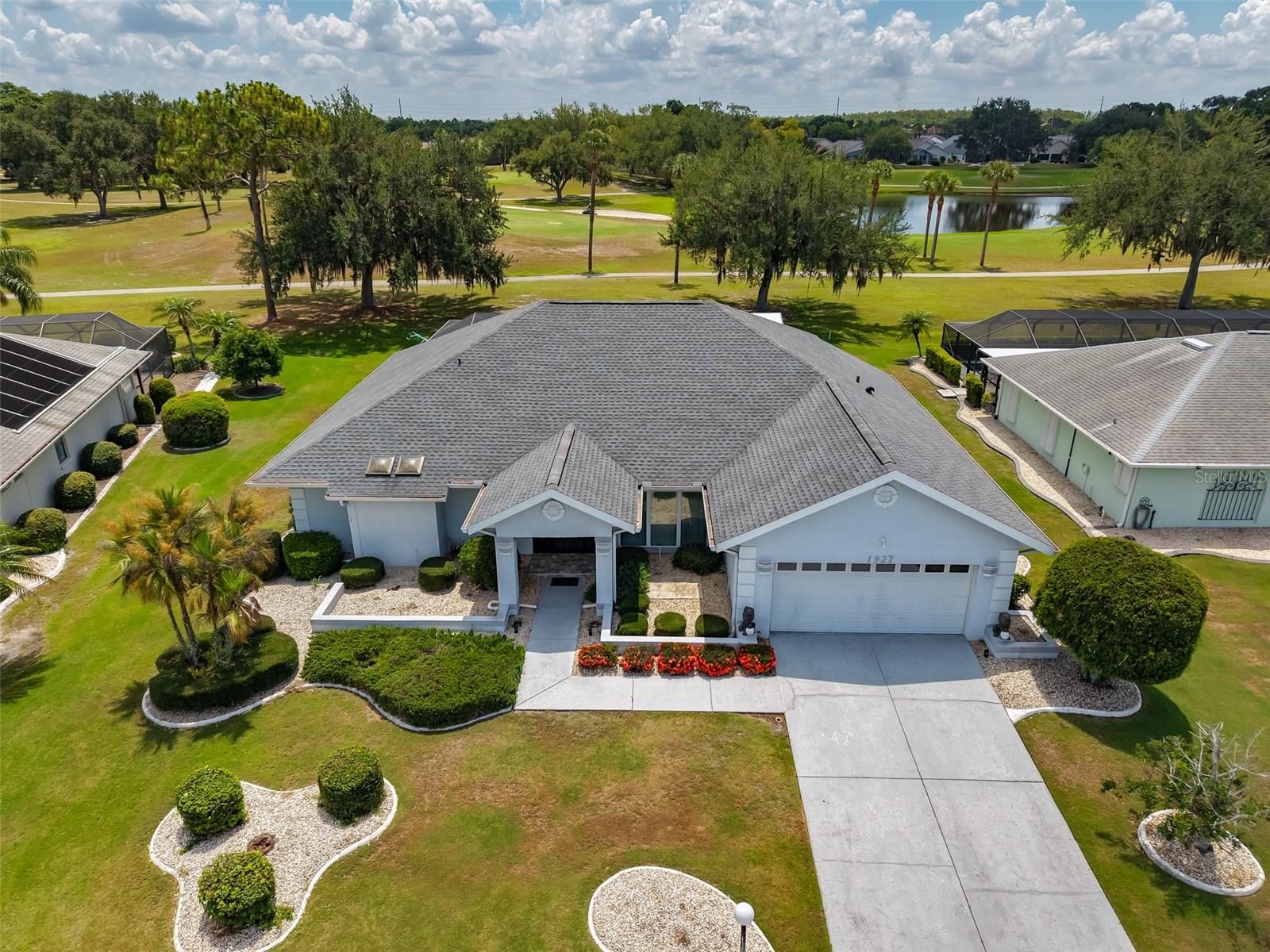 Virtually Staged. LOCATION! LOCATION! LOCATION!  Welcome to this lovely POOL home in the highly sought after LOW HOA neighborhood of CALOOSA COUNTRY CLUB ESTATES, where pride of ownership truly stands out!  This home is nestled on a large PREMIUM lot with STUNNING VIEWS OF THE CALOOSA GOLF COURSE in your own backyard.  This 2 bedroom/2 bath floorplan boasts almost 2400 square feet of versatile living space.  Step inside to the grand living/dining room combo featuring soaring high ceilings and opens into the 9 x 31 tiled sunroom, where you'll fall in love with the terrific views of the golf course all across the rear of the home.  The eat-in kitchen offers plenty of cabinets & counter space and has a cozy dinette area for casual gatherings.  The owner's suite is your own private oasis with an ensuite bathroom with jacuzzi tub & walk-in shower, skylights for lots of natural light and a separate slider for easy access to the sunroom.  The spacious 2nd bedroom and bathroom are located at the opposite side of the home for extra privacy for guests.  As an added convenience, this bathroom also has direct access to the pool area.   The fabulous sunroom has a wall of sliders that opens up to the amazing screened lanai area that features your very own pool & spa plus panoramic views of the golf course.   Sun City Center is a golf cart community that offers numerous amenities such as shopping, restaurants, banking, doctors & on site hospital, many social & sporting clubs and so much more.  The community is also conveniently located to major highways, airports, Tampa, Sarasota, award winning beaches, and of course Disney.  So come and visit this home today to see why you'll want to call it yours!