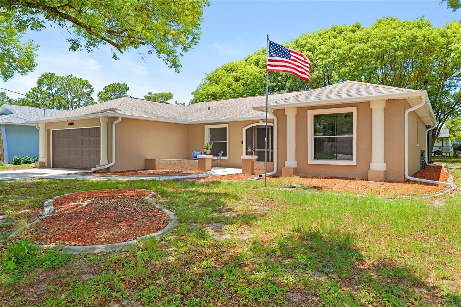 Welcome to this newly updated 4-bedroom, 2-bathroom home offering 1,884 square feet of living space, 2,640 total square feet under roof, and an attached 2-car garage. Major improvements include a new air-conditioning system, water heater, appliances, lighting, and ceiling fans.

Enter through the double-door entry into a spacious living and dining room combination featuring vaulted ceilings, ceramic tile flooring, and sliding glass doors that open to the screened-in lanai. The lanai is already equipped with a 220-volt electrical connection, providing the perfect setup for the future installation of a spa or hot tub. The parcel is also partially fenced, allowing the new owner to complete the remaining fencing with minimal effort.

The thoughtfully designed split-bedroom floor plan provides privacy and plenty of room for family and guests. To the right of the entry, a hallway leads to the first guest bedroom at the rear of the home, which includes direct access to the screened lanai. Nearby, the updated guest bathroom features a tub-and-shower combination, quartz countertop, and recessed lighting. The second guest bedroom is located toward the front of the home and includes a walk-in closet and new ceiling fan. All four bedrooms feature comfortable carpeted flooring.

At the center of the home is the updated kitchen, complete with new appliances, quartz countertops, refinished cabinetry with new hardware, updated overhead lighting, and a convenient eat-in kitchen nook. Just beyond the breakfast nook is the fourth bedroom, located at the rear of the home and featuring a standard closet.

The spacious primary bedroom is located beyond the laundry room and features carpeted flooring, a new ceiling fan, and updated lighting. The refreshed primary bathroom offers dual sinks, quartz countertops, and attractive picture-frame mirrors.

The indoor laundry room provides direct access to the garage and includes a large closet for additional storage. Inside the garage, you will find painted flooring, a deep utility sink, and an overhead storage cabinet.

With vaulted ceilings, generous living spaces, an updated interior, abundant storage, a partially fenced parcel, and a screened lanai ready for a future spa, this move-in-ready home offers comfort, functionality, and plenty of room to enjoy.